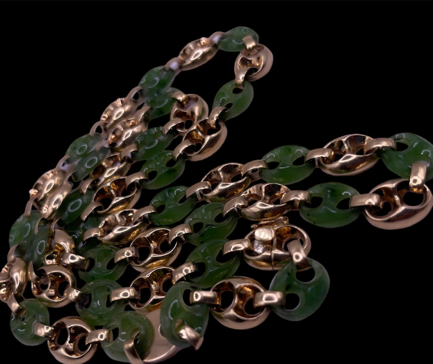 A carved nephrite jade and 14kt gold necklace