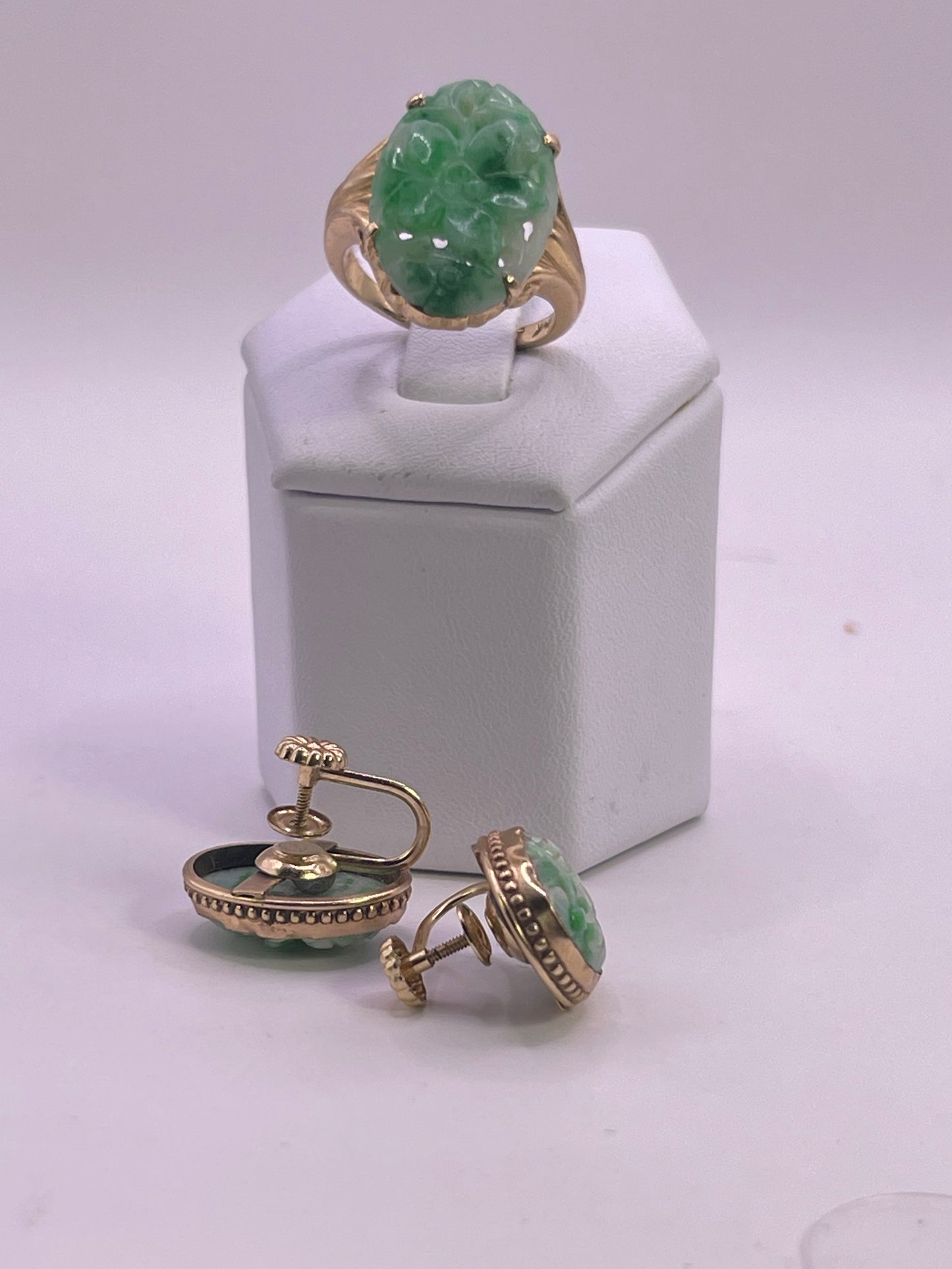 A jade jewelry set is 14kt gold setting