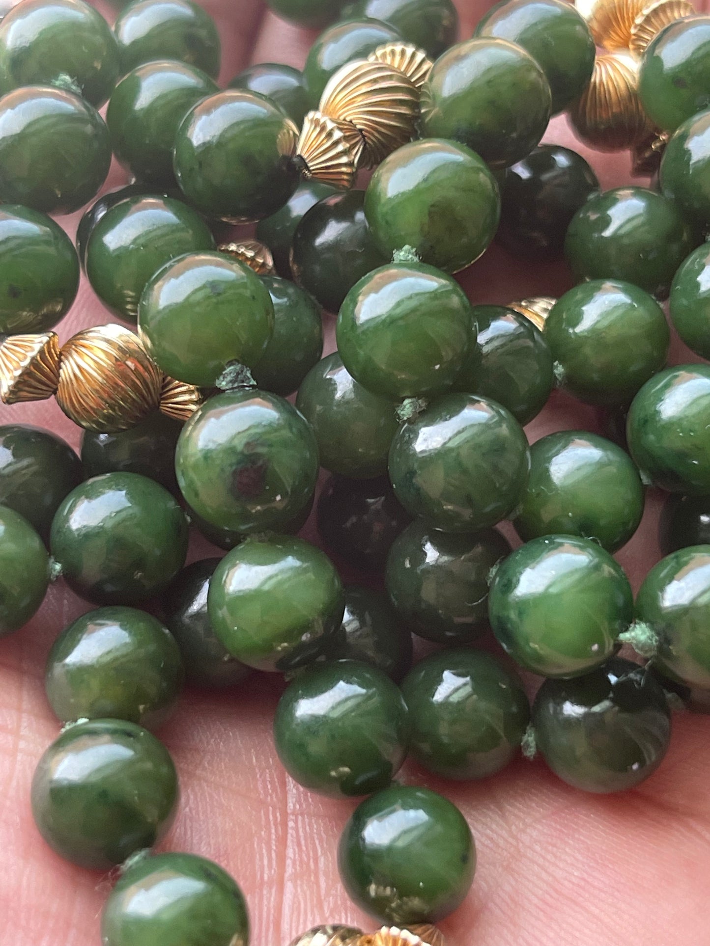 A jade nephrite and gold bead necklace