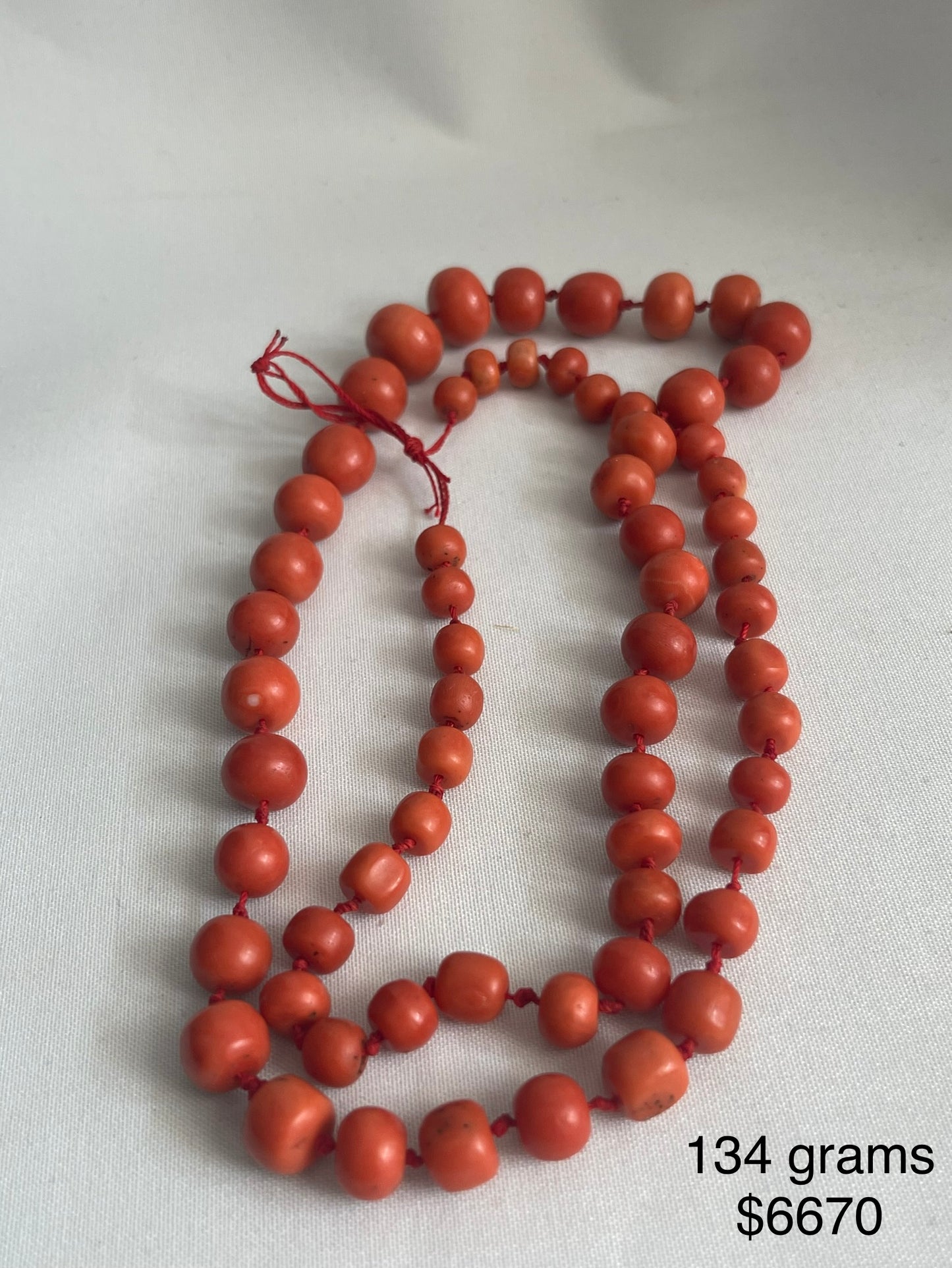 A necklace with vintage momo coral beads