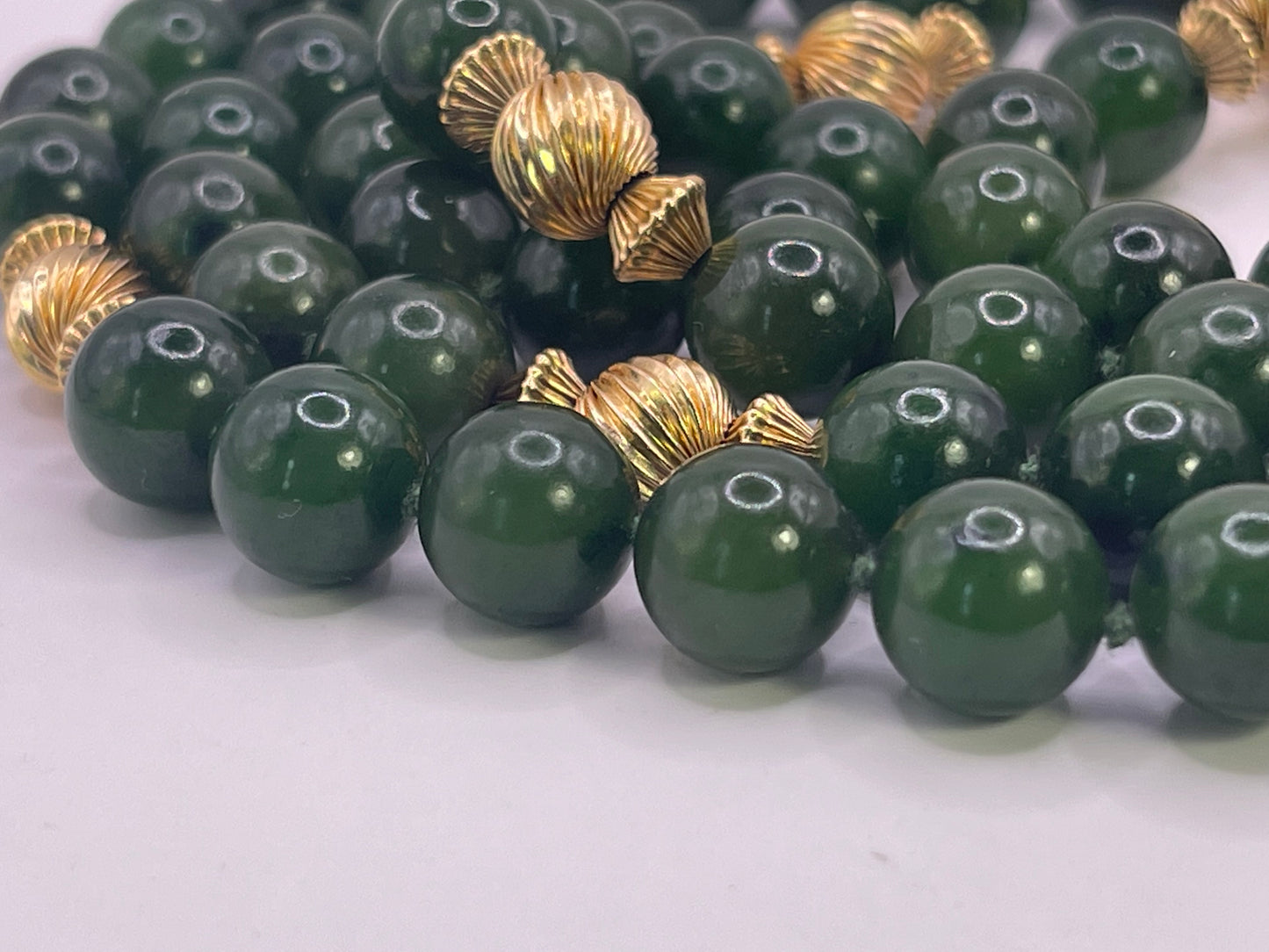 A jade nephrite and gold bead necklace