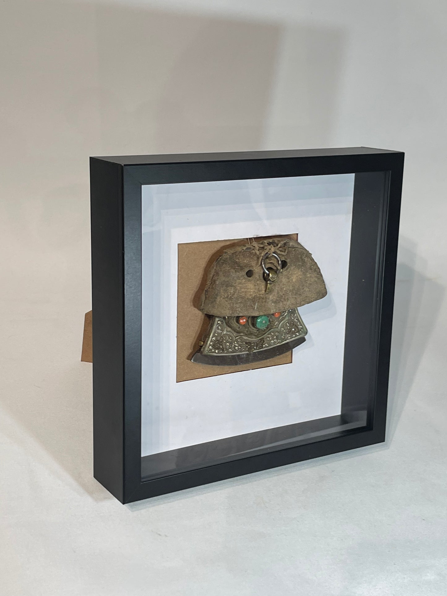 An antique framed Tibetan mechak- flint purse with leather cover