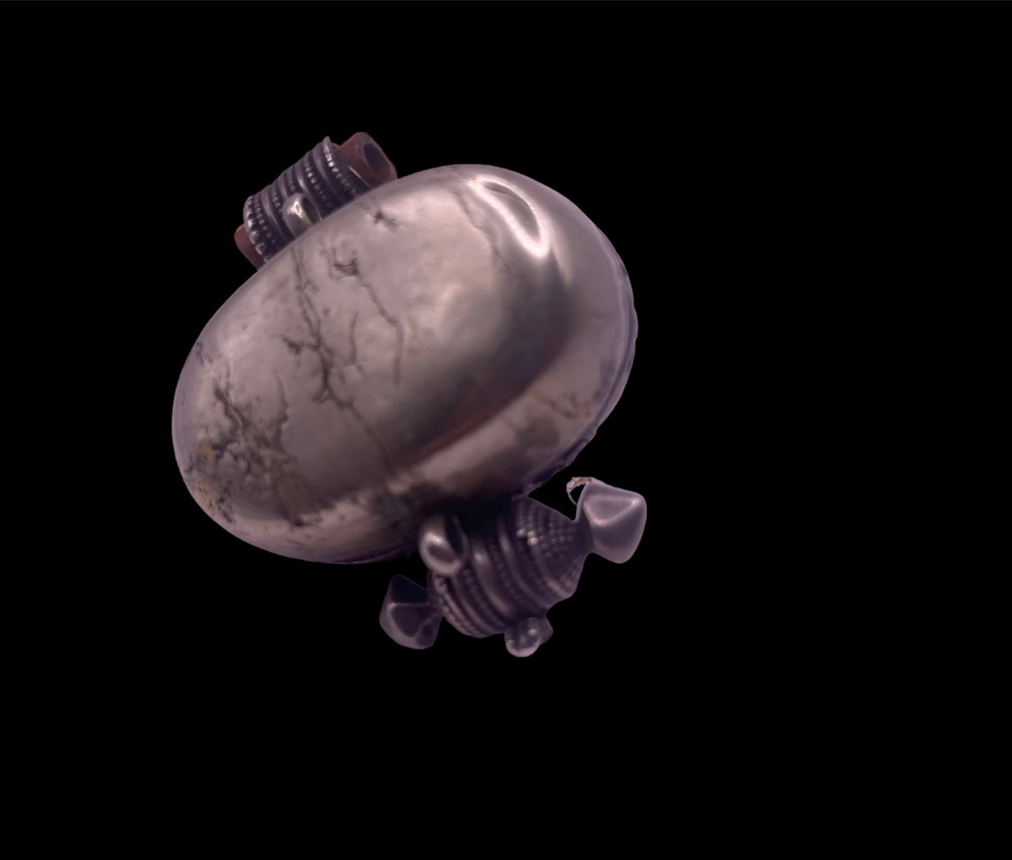 An antique silver and coral ghau amulet