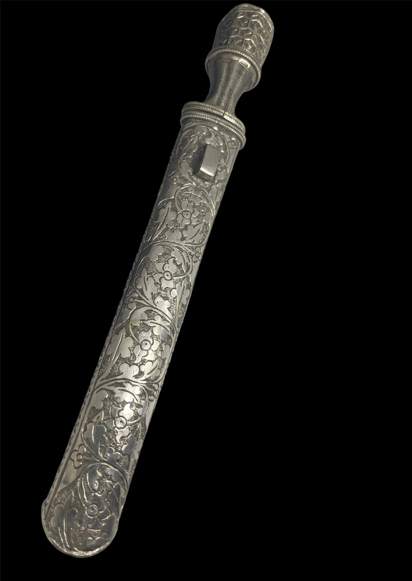 An antique Tibetan dagger with a carved silver sheath