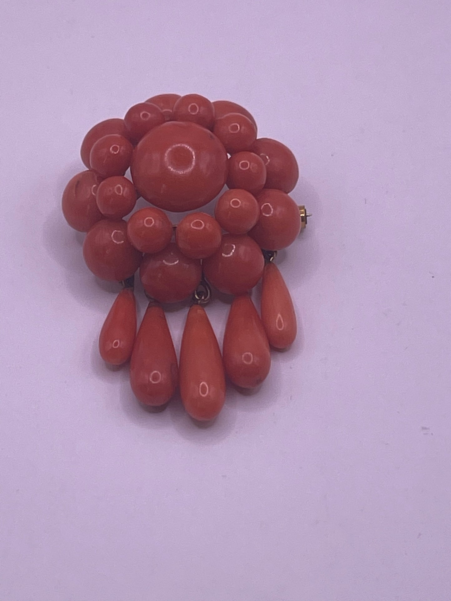 A natural untreated coral orange/ pink pin/ pendant