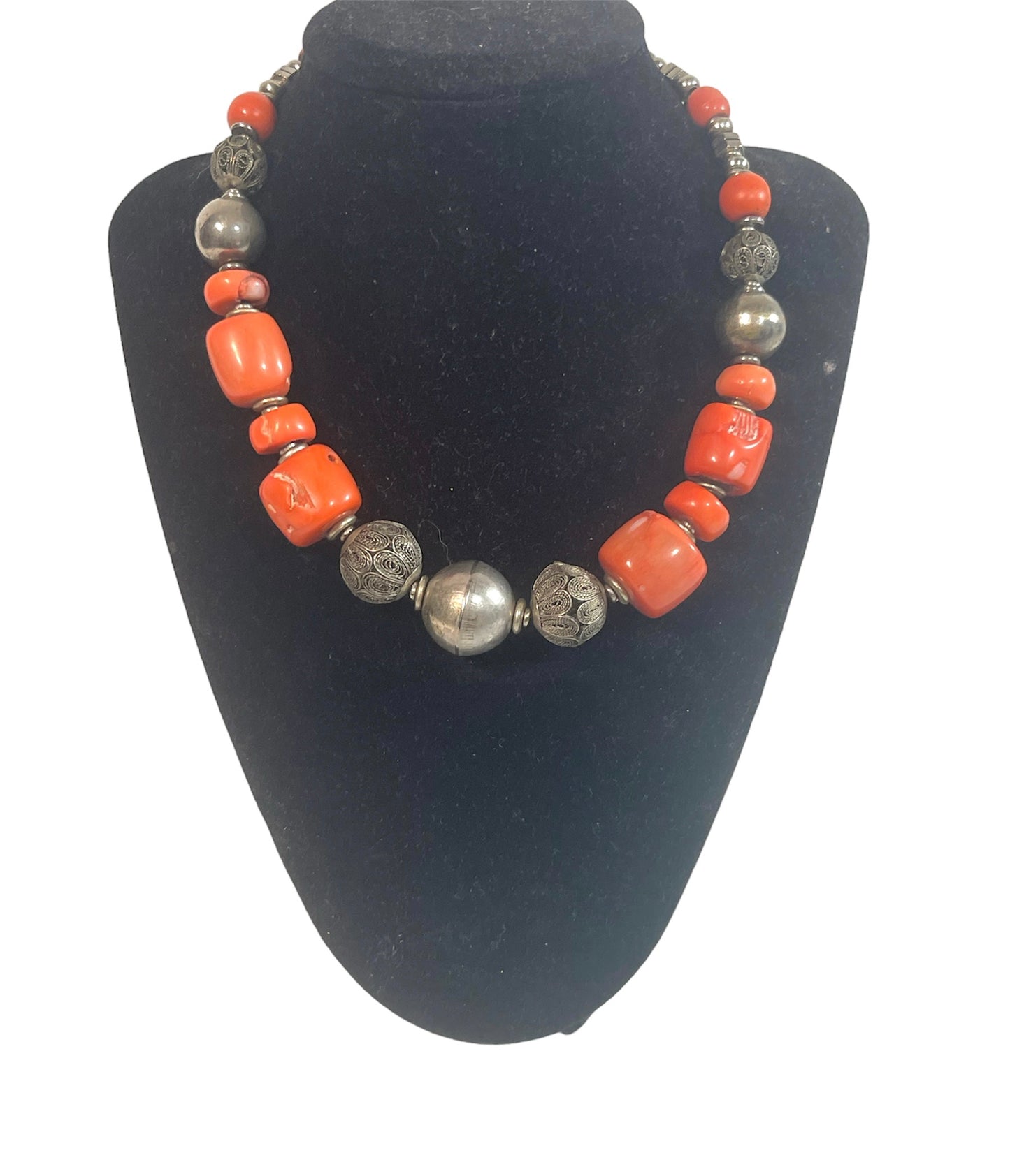 A coral and silver necklace