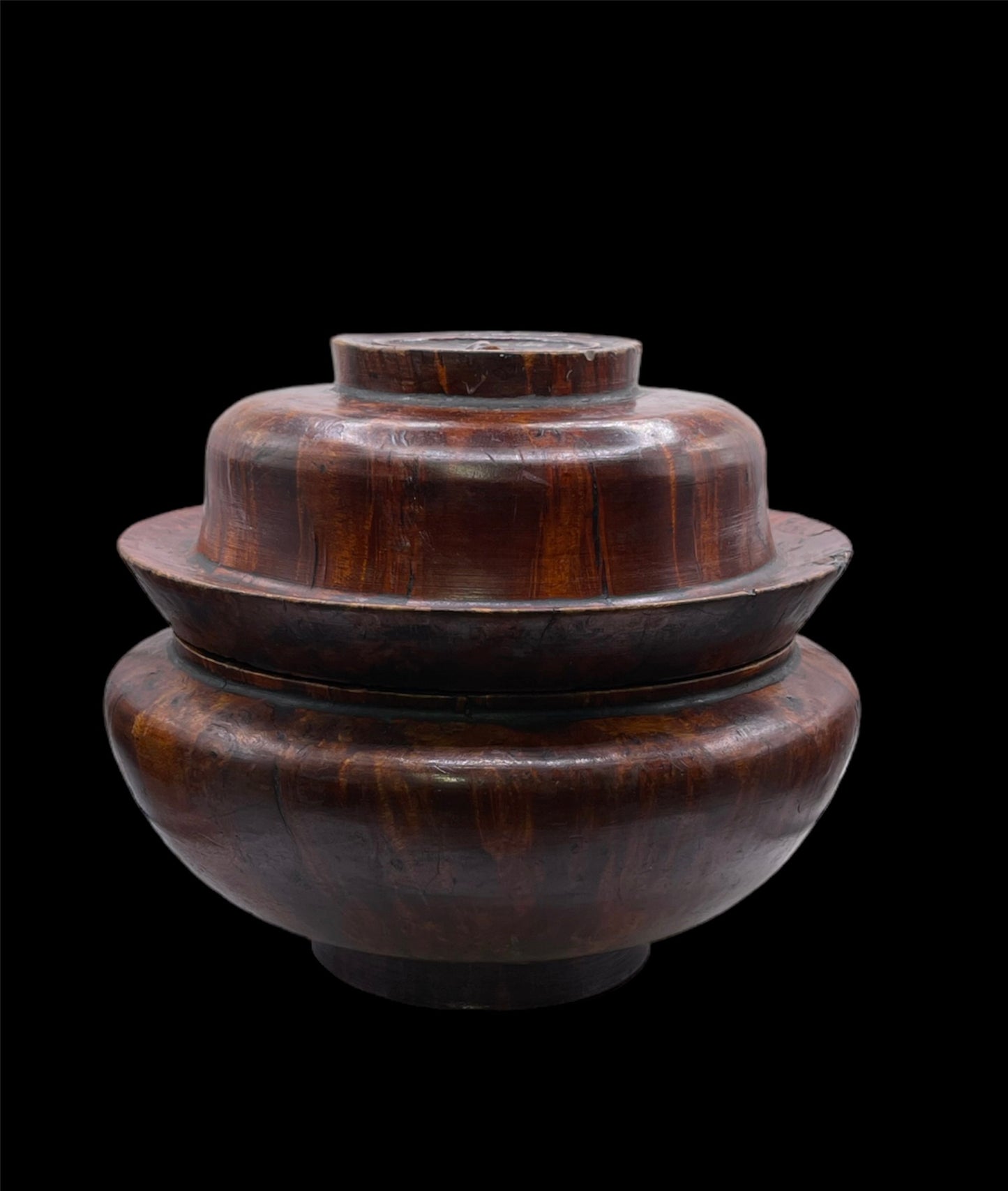 An antique burlwood tsampa container with lid