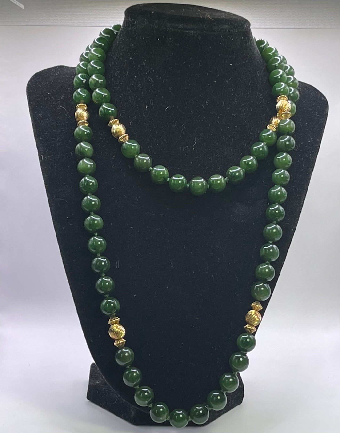 A jade nephrite and gold bead necklace