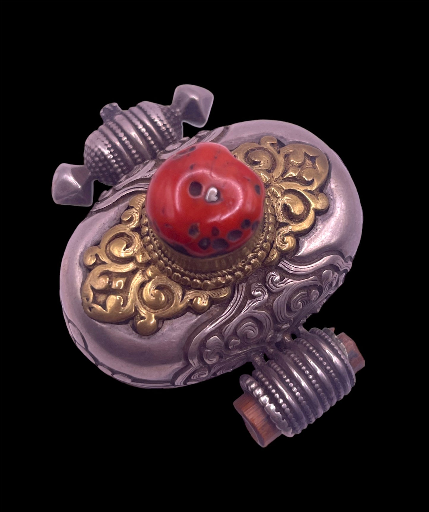 An antique silver and coral ghau amulet