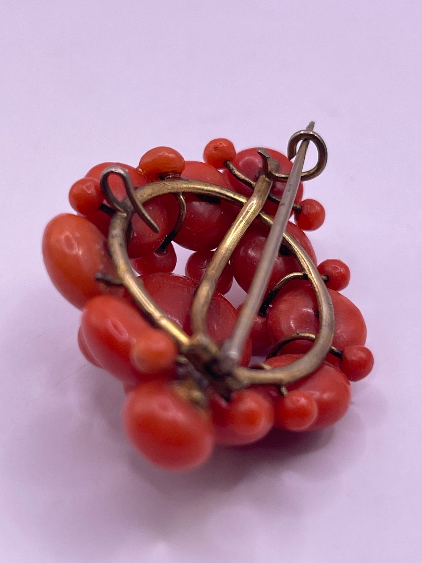 A natural untreated coral orange/ pink pin/ pendant