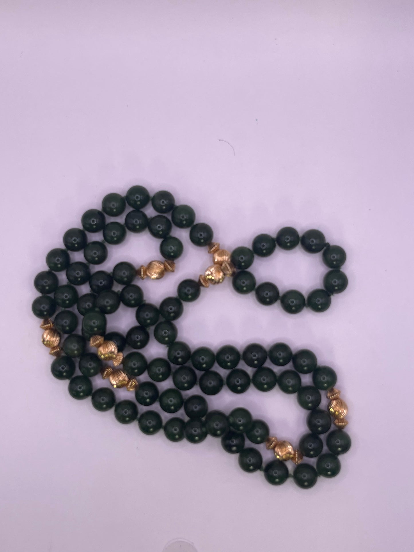 A jade nephrite and gold bead necklace
