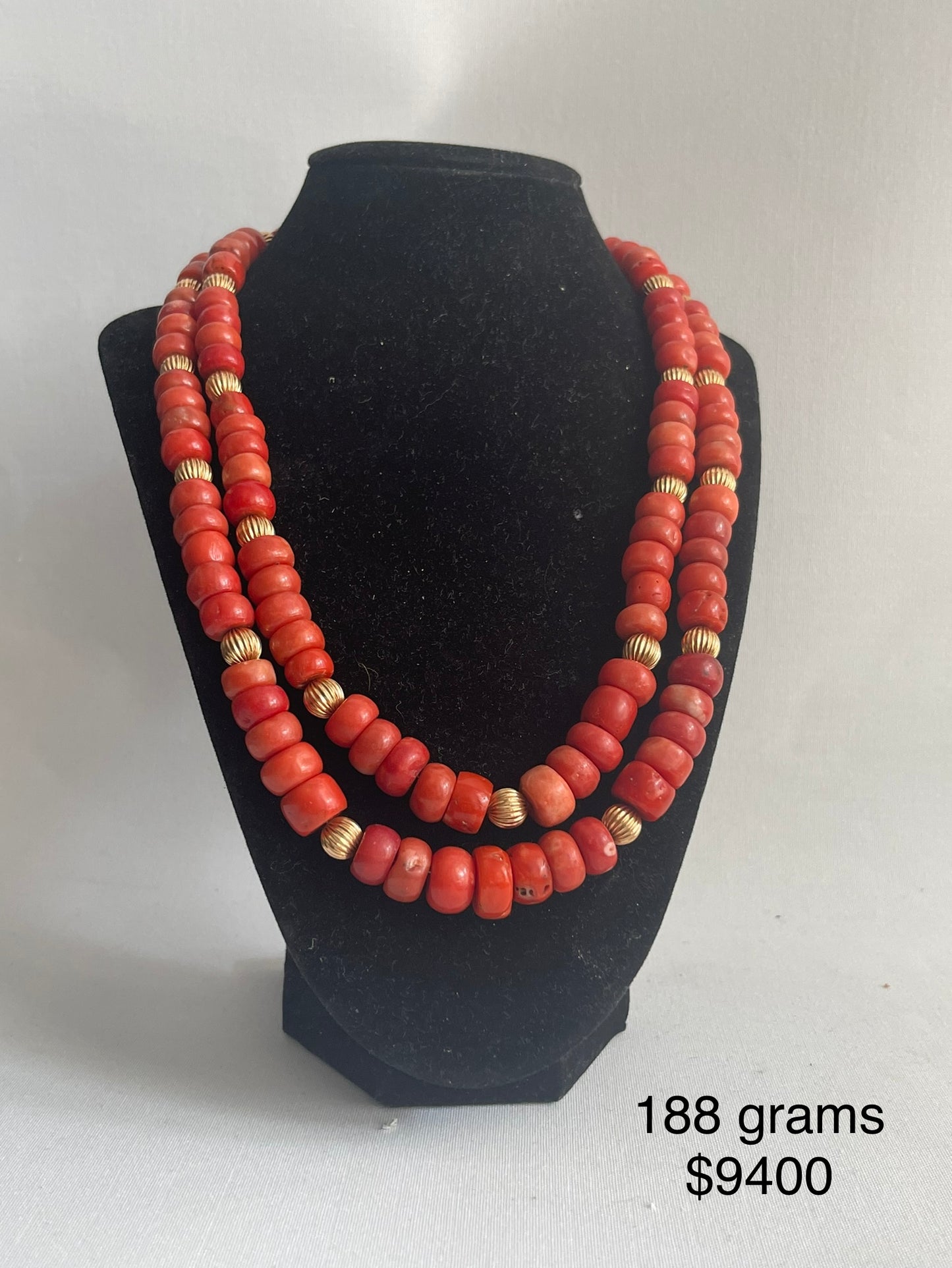 A coral and gold bead necklace