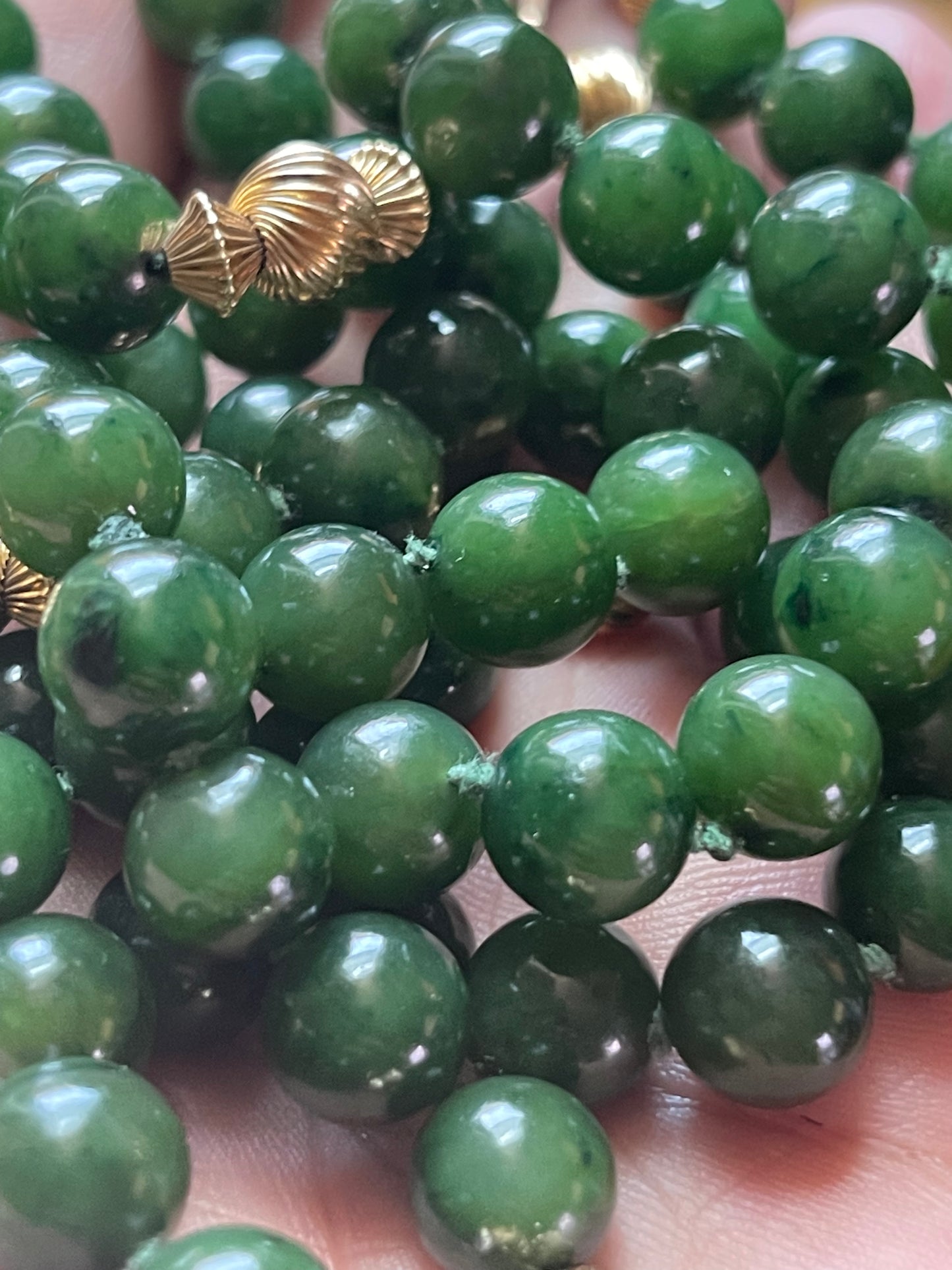 A jade nephrite and gold bead necklace