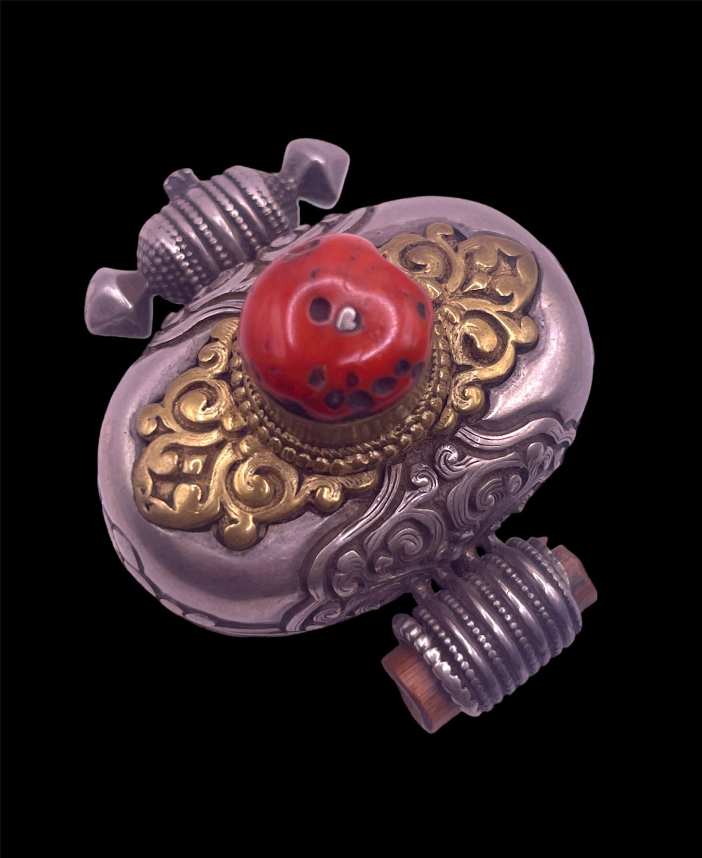 An antique silver and coral ghau amulet