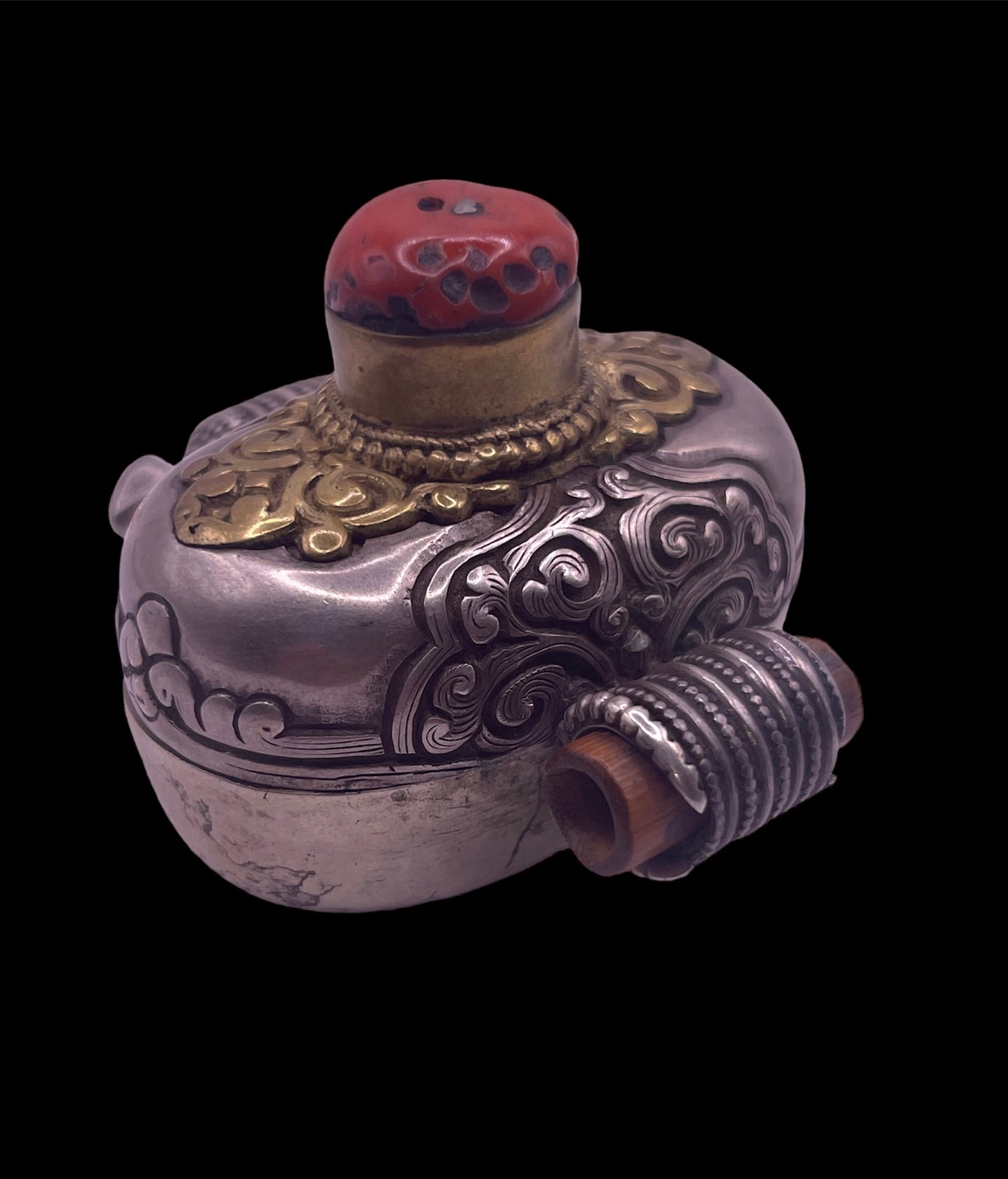 An antique silver and coral ghau amulet