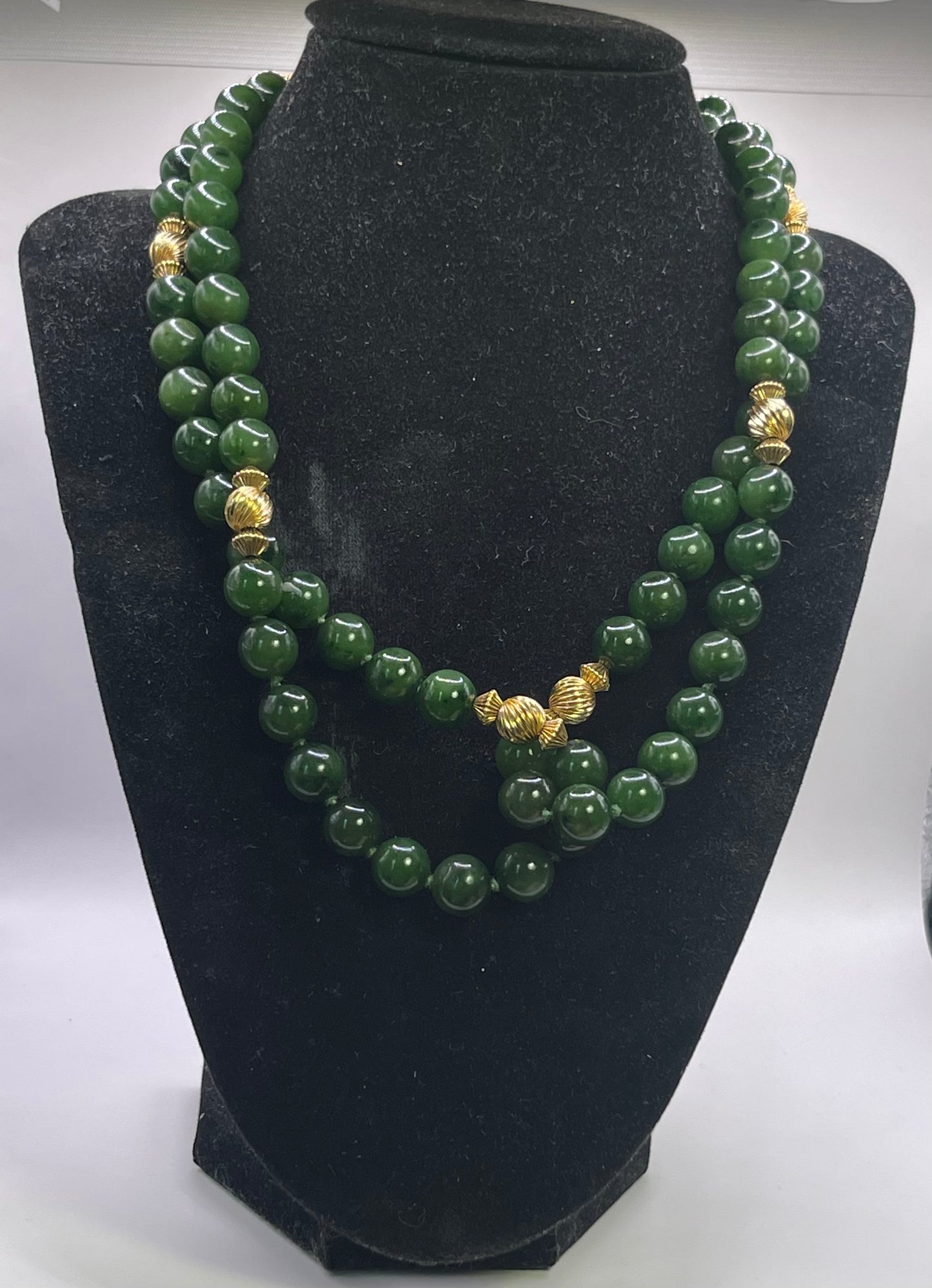 A jade nephrite and gold bead necklace