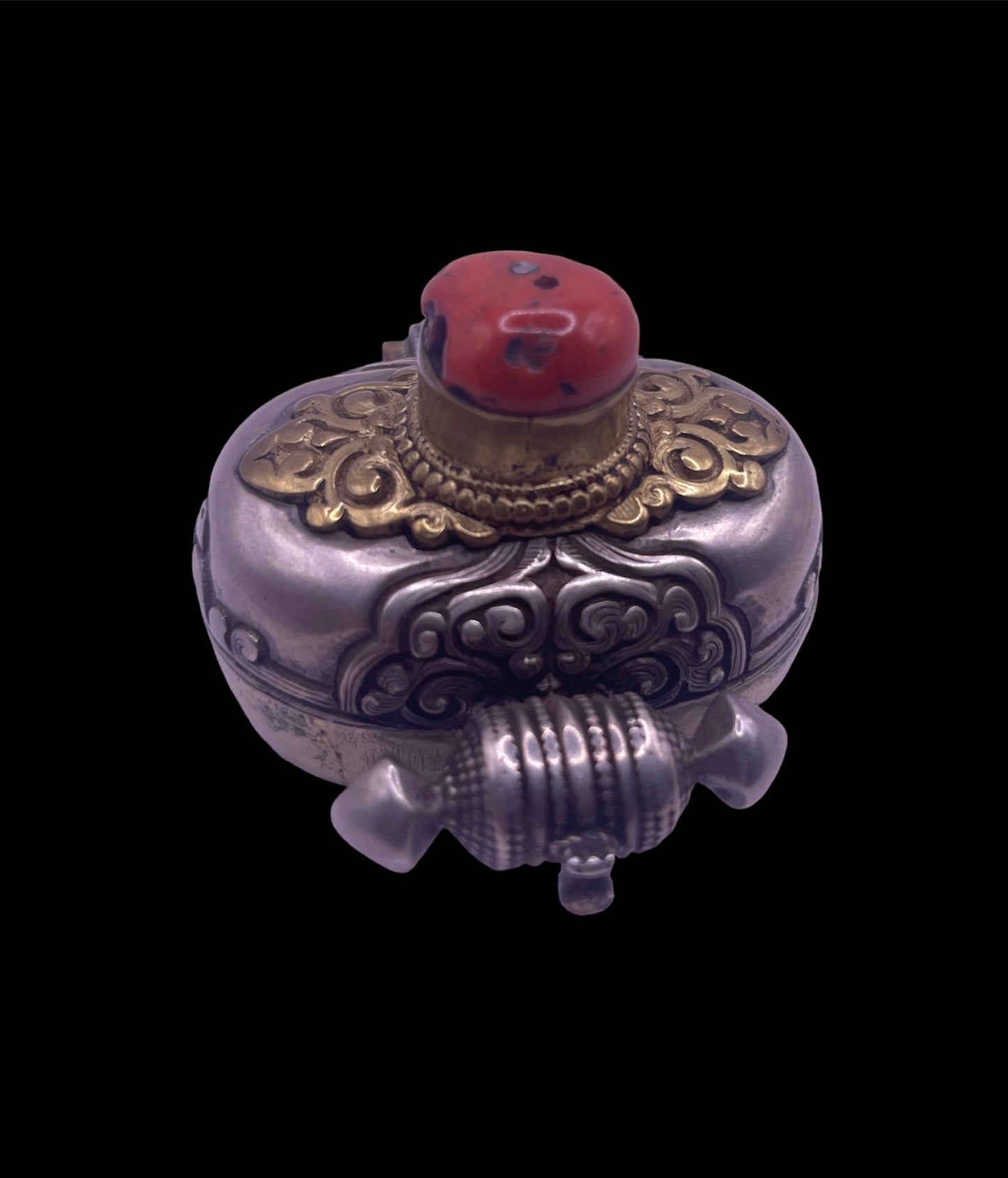 An antique silver and coral ghau amulet