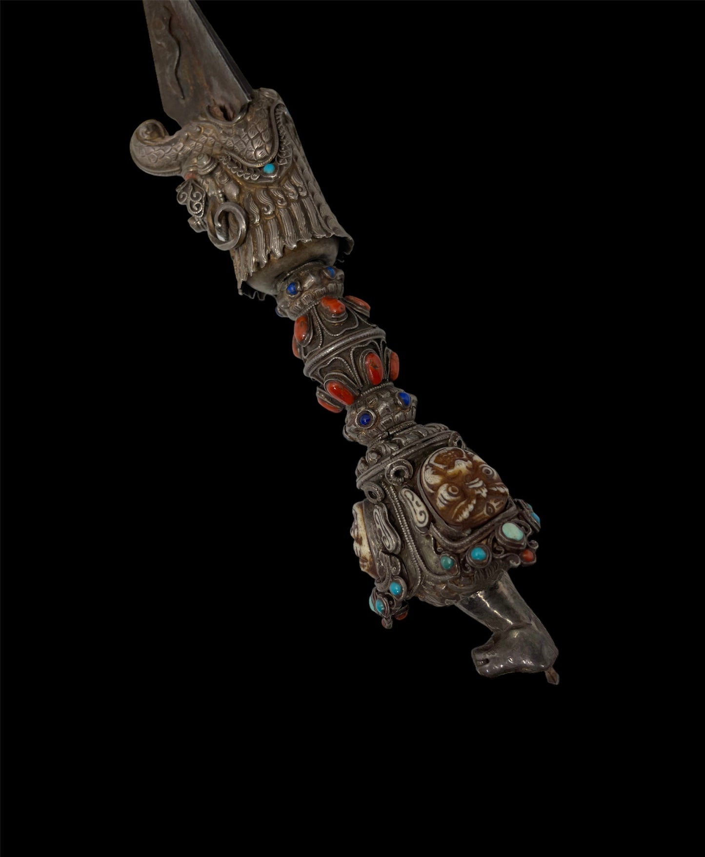 A vintage ceremonial Tibetan dagger in silver and precious stones
