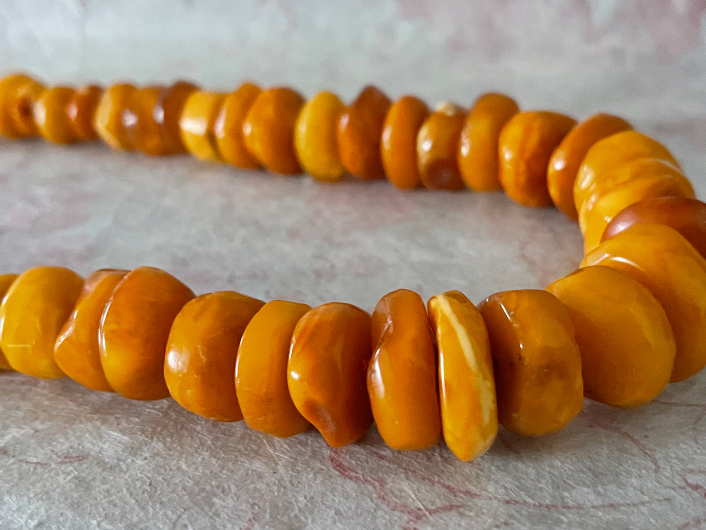A vintage butterscotch amber bead necklace