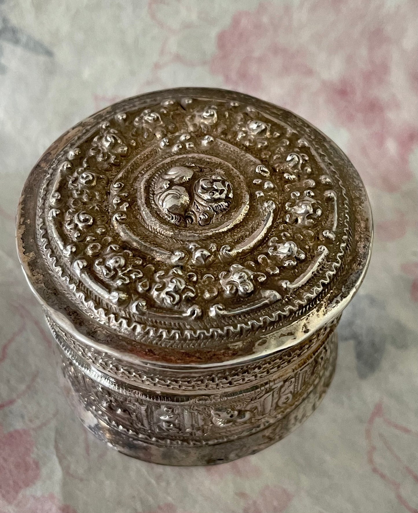 An antique silver south East Asian round box with lid