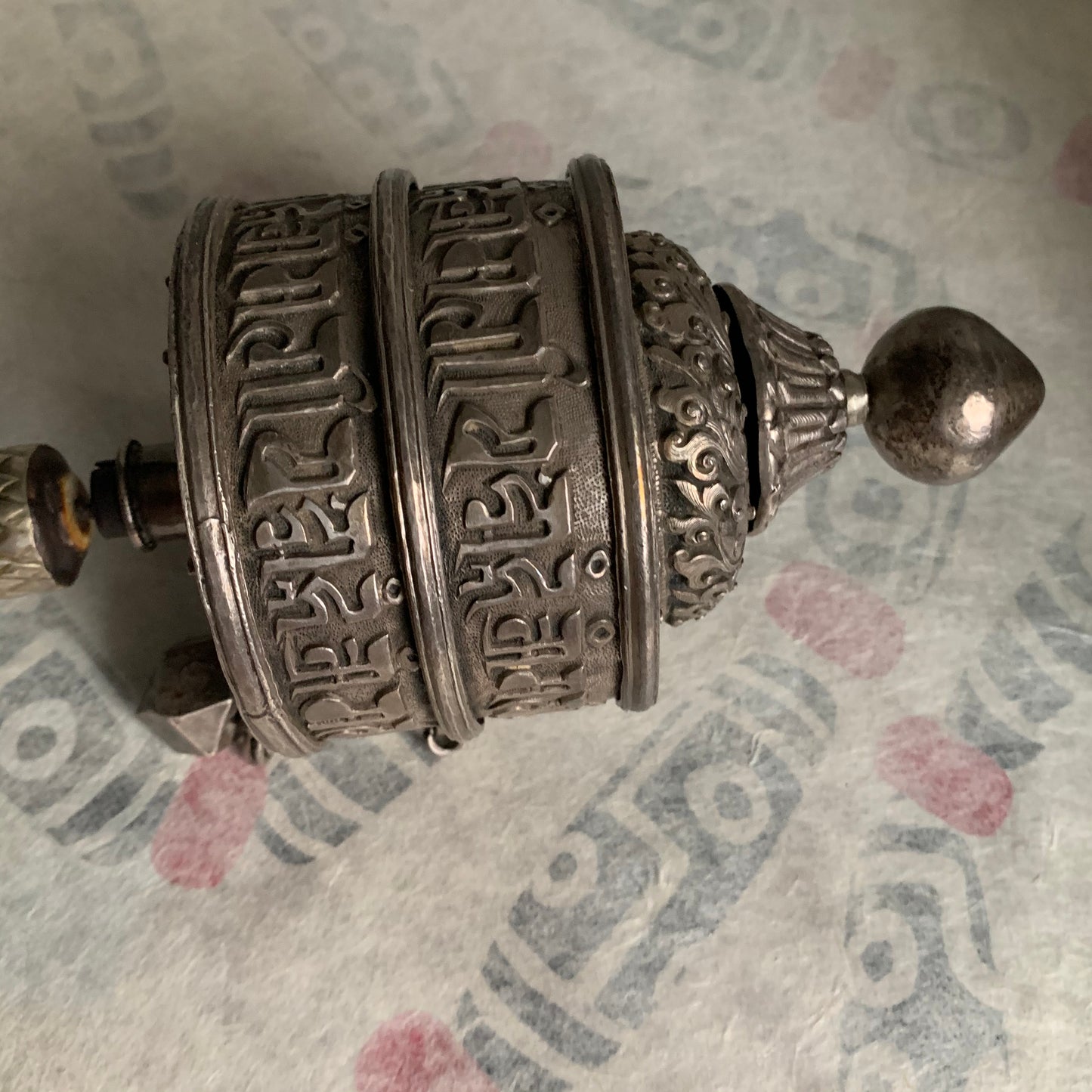An antique Tibetan handheld prayer wheel