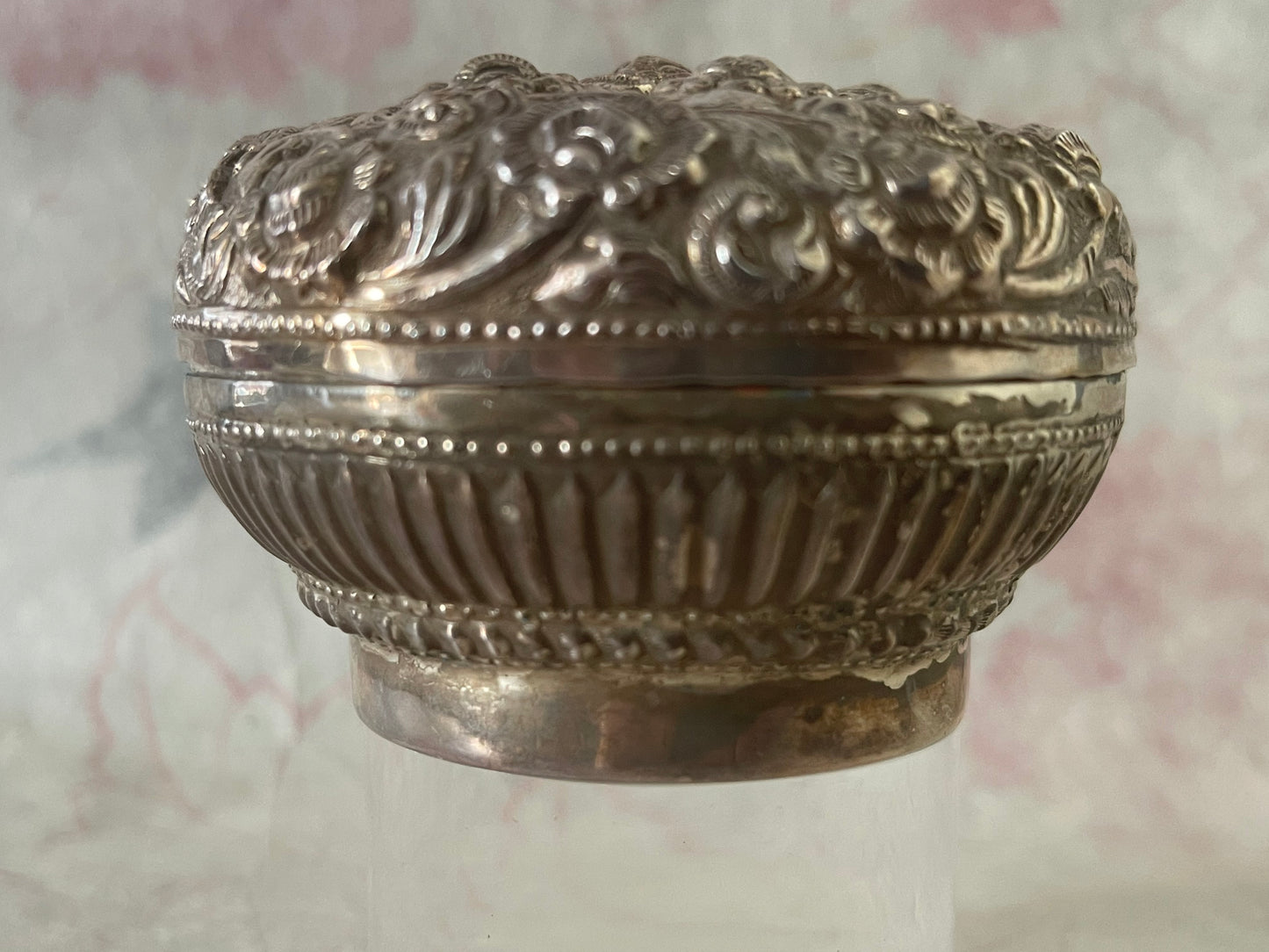 An antique silver south East Asian round box with lid