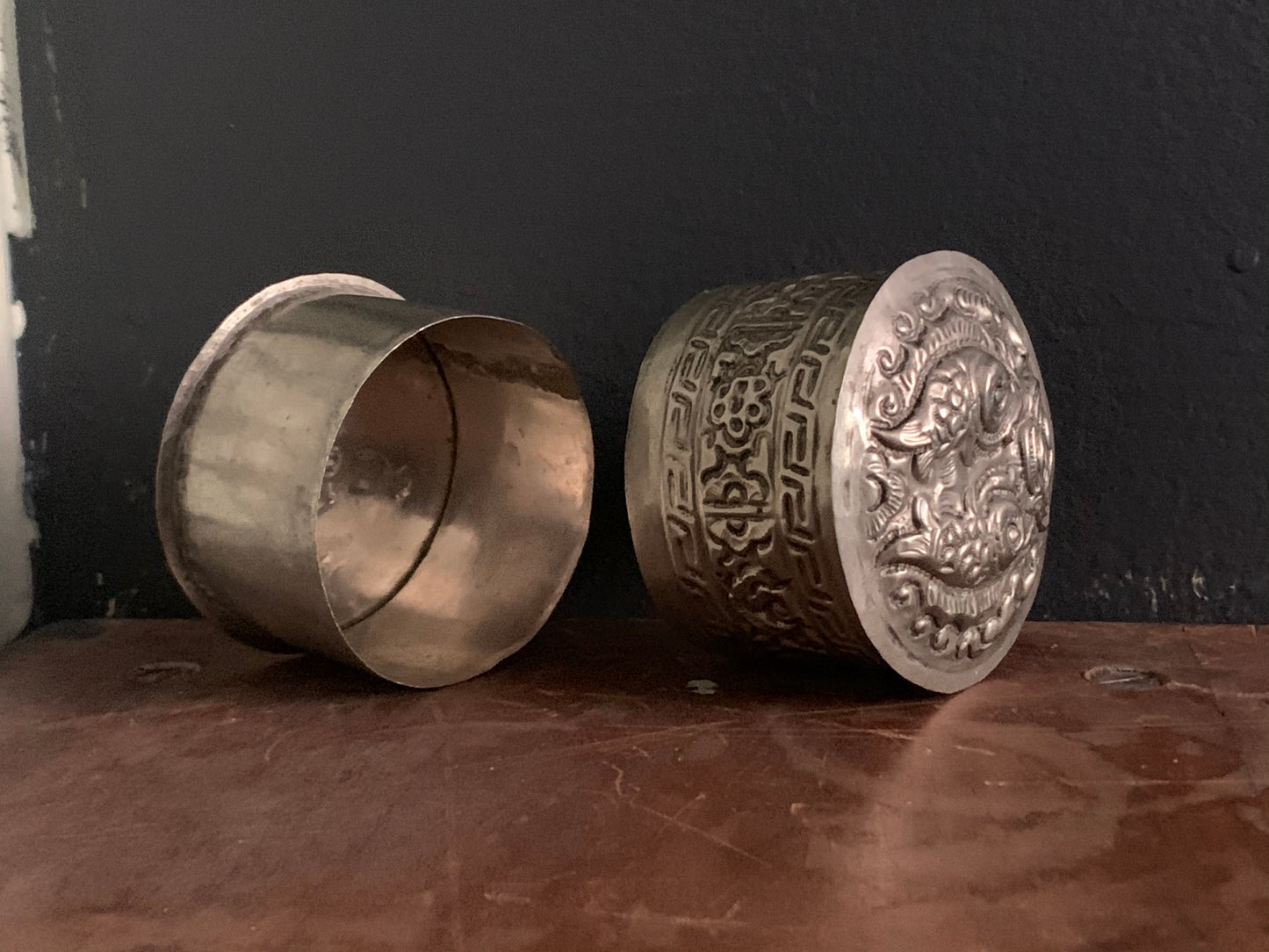 A cylindrical silver box