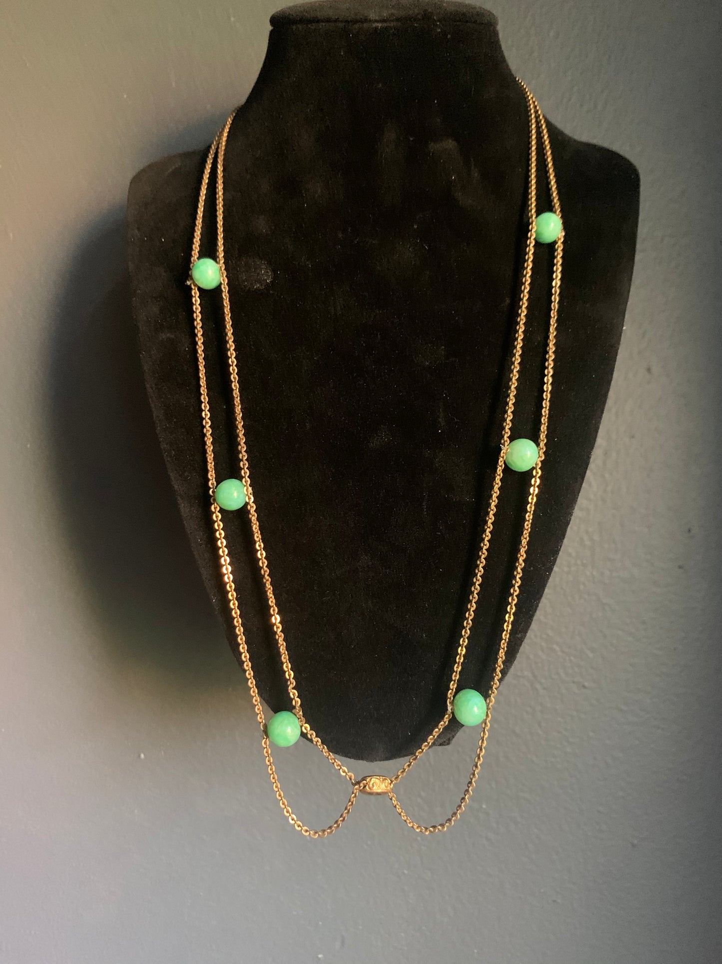A jade and gold necklace