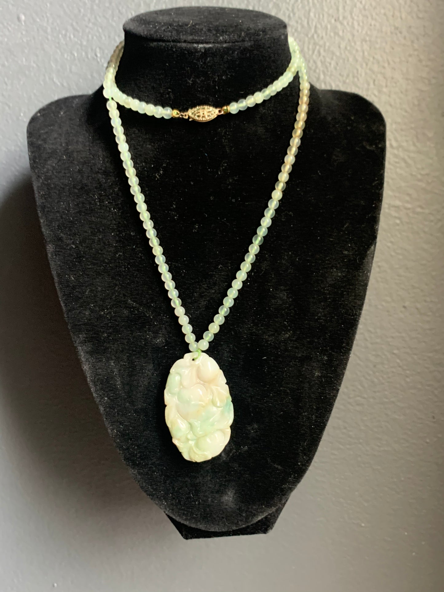 A jade necklace and pendant