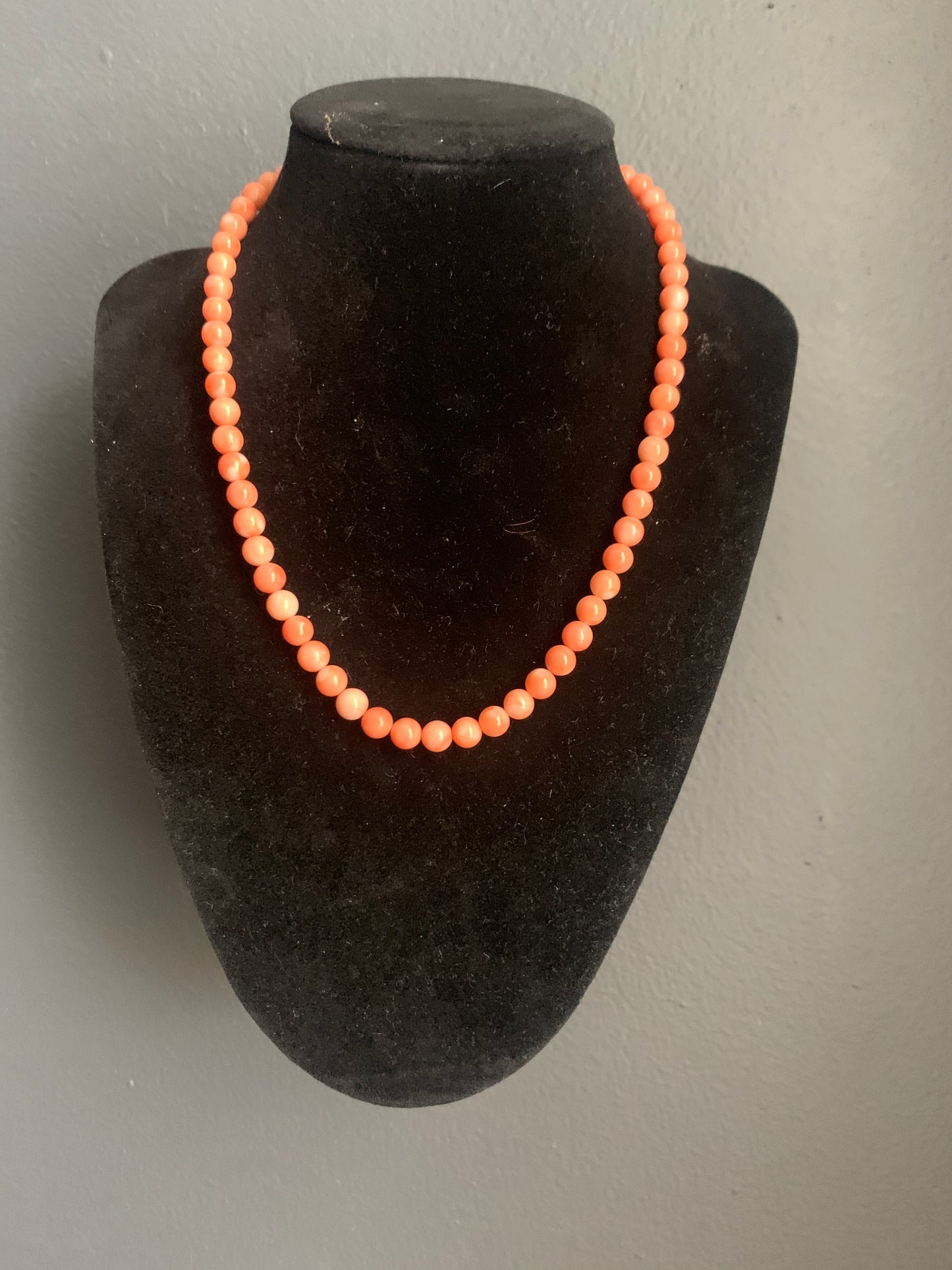 A salmon color coral necklace