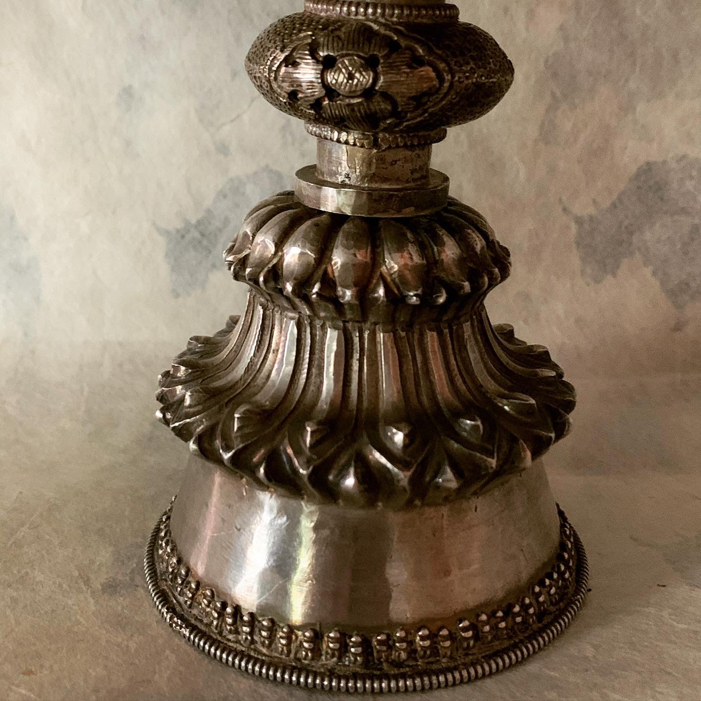 An antique Tibetan silver butterlamp