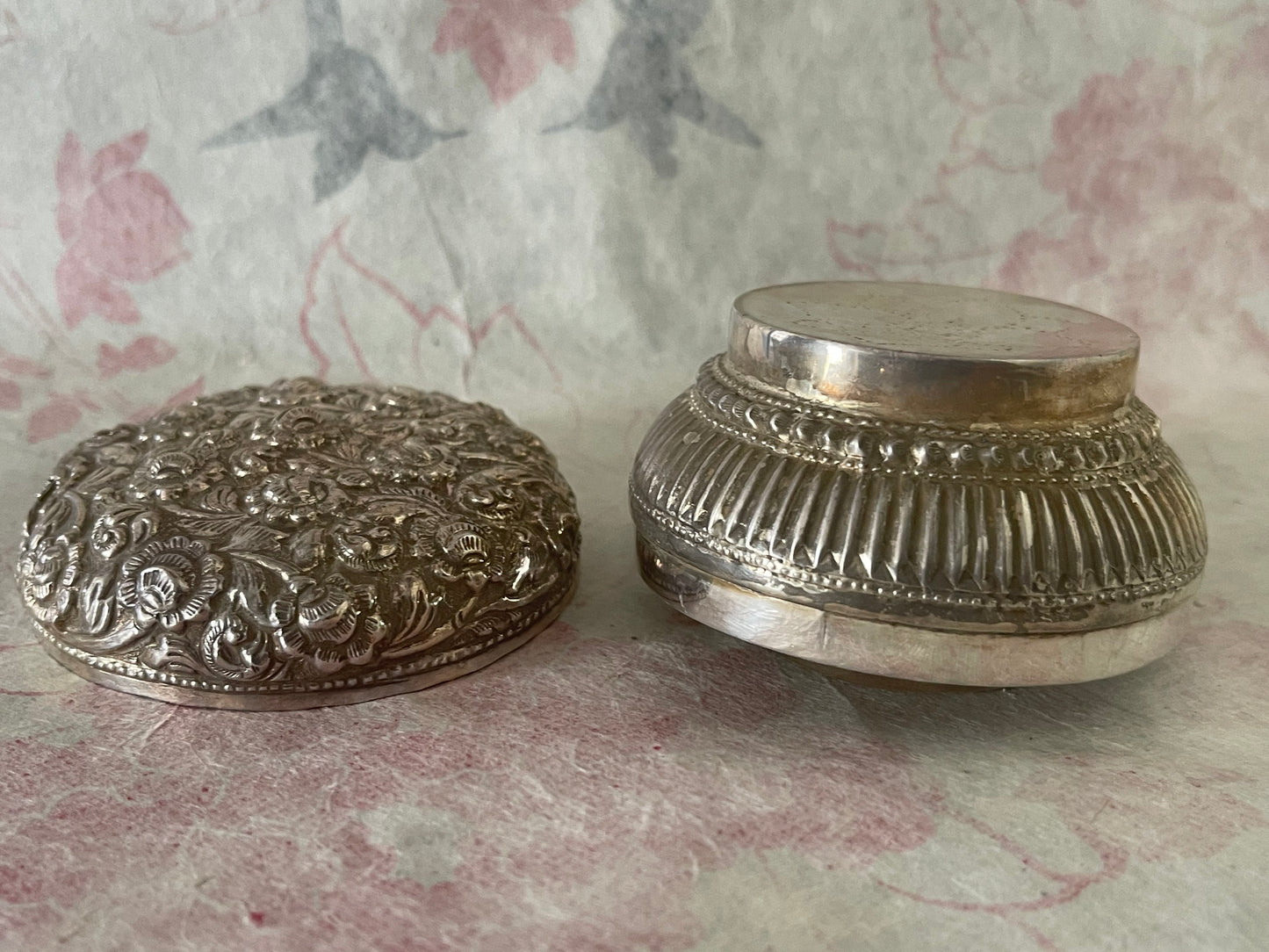 An antique silver south East Asian round box with lid