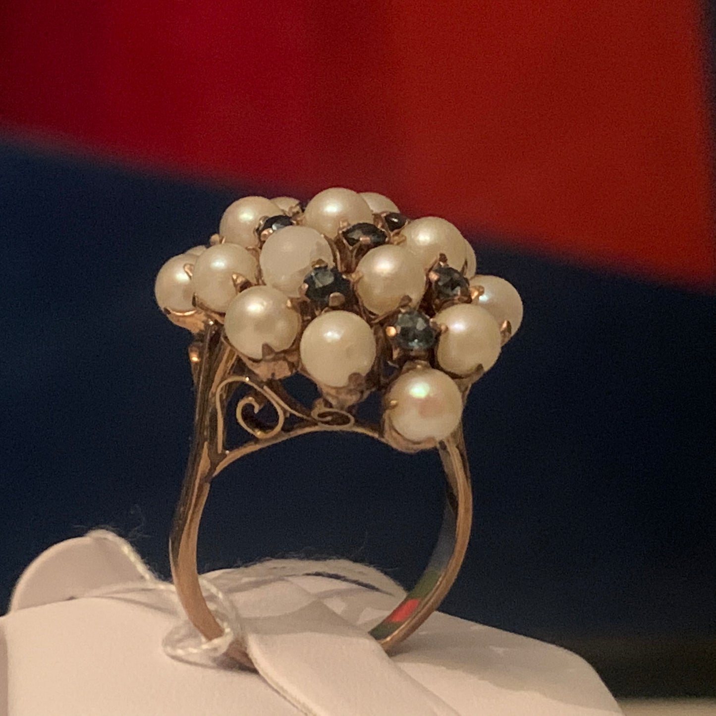 A pearl and sapphire ring in a 14kt setting