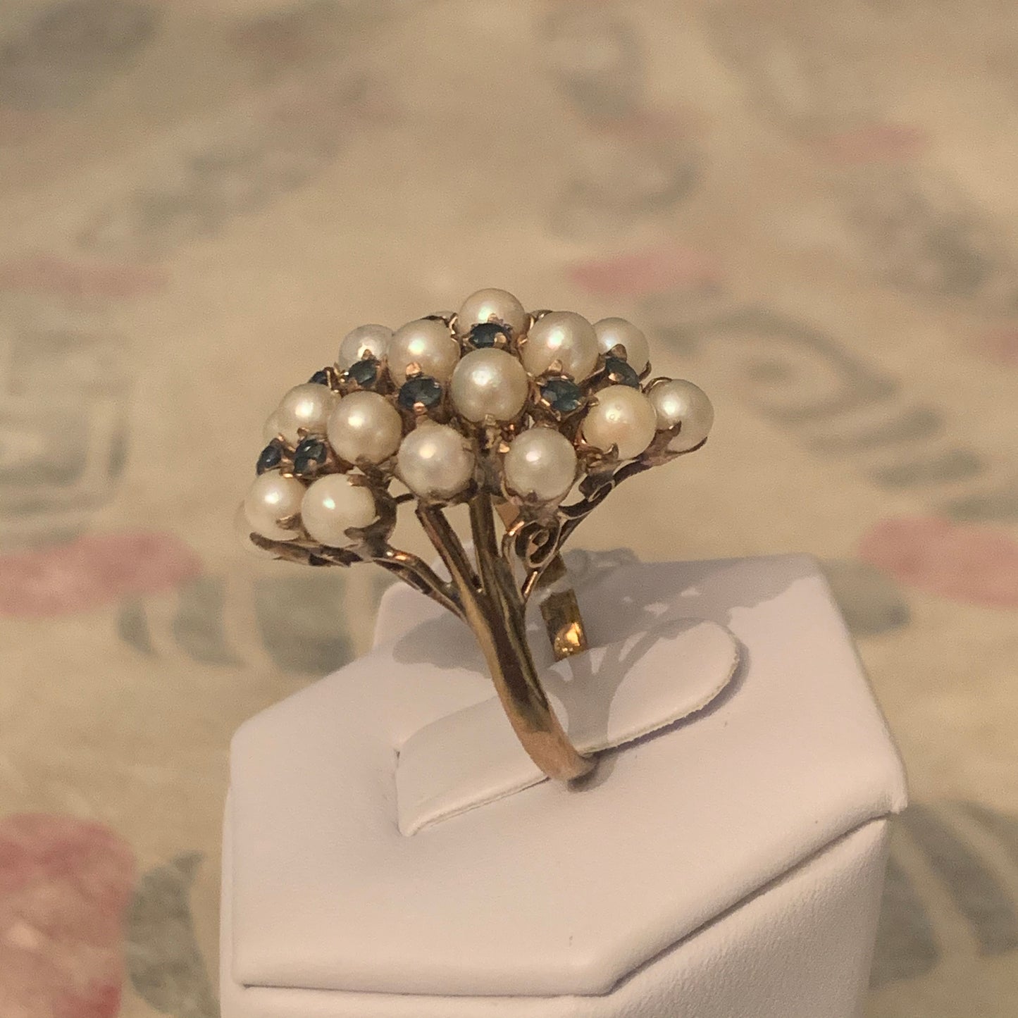 A pearl and sapphire ring in a 14kt setting