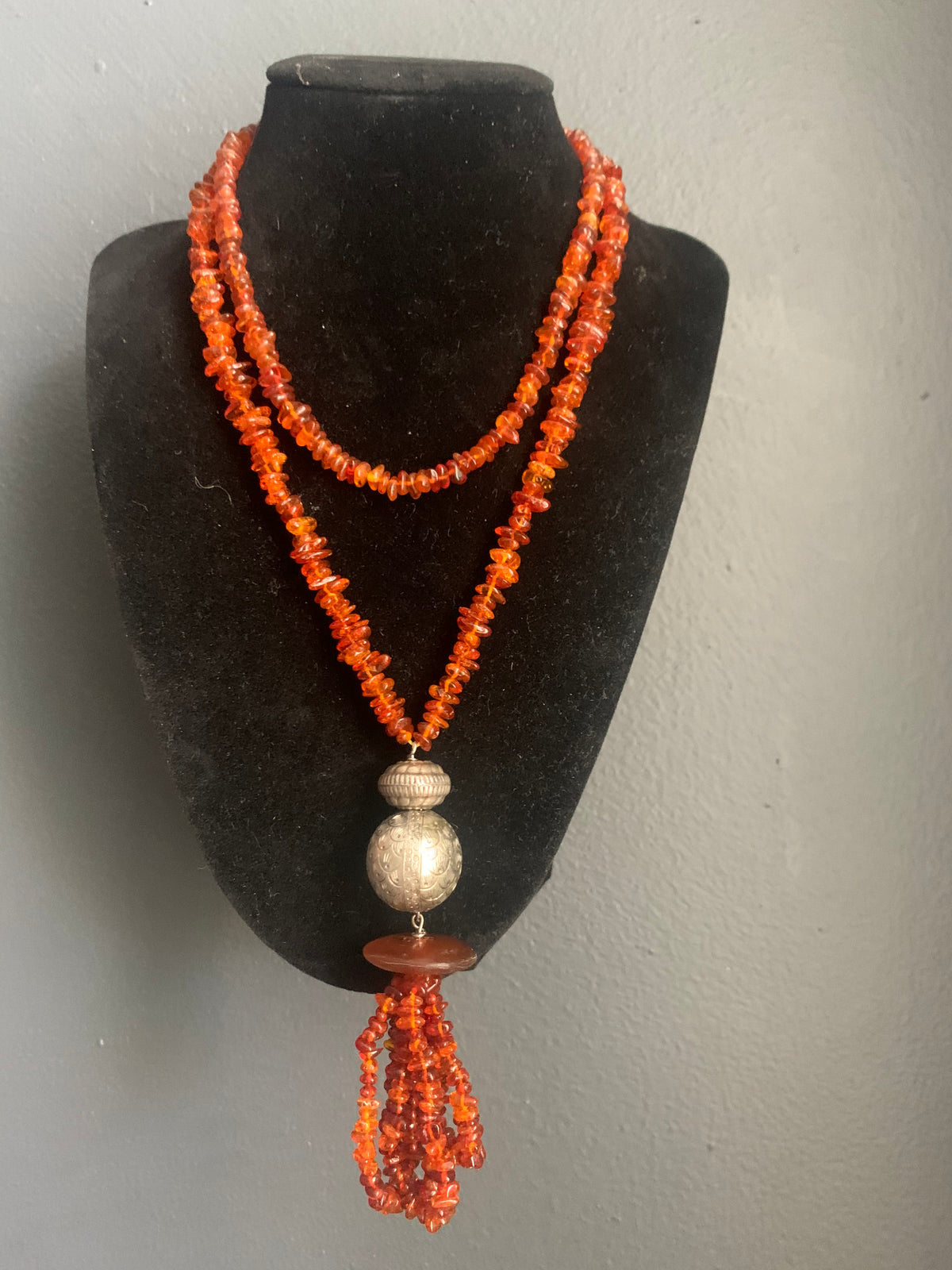 An amber and silver necklace