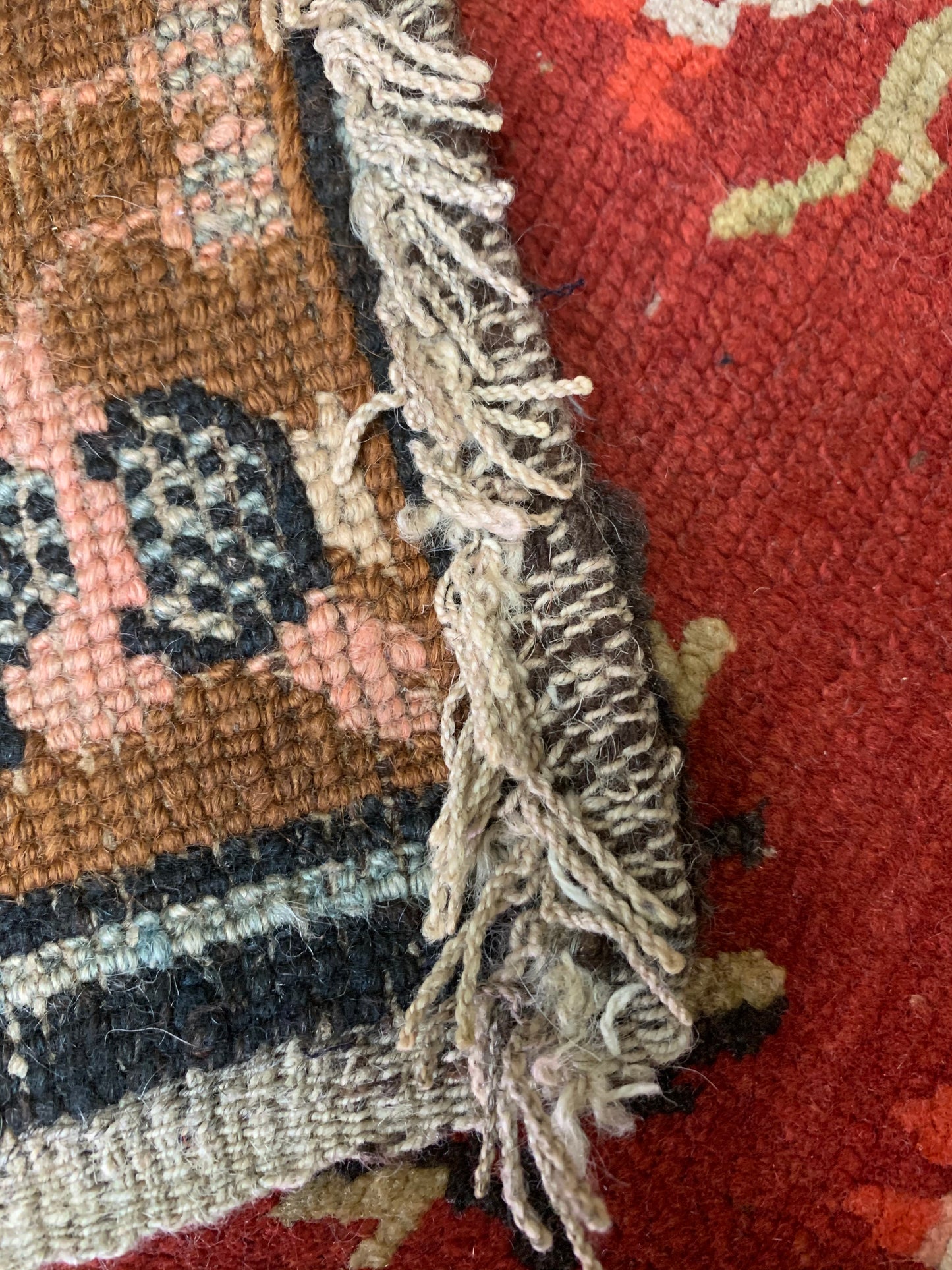 An antique Tibetan wool rug