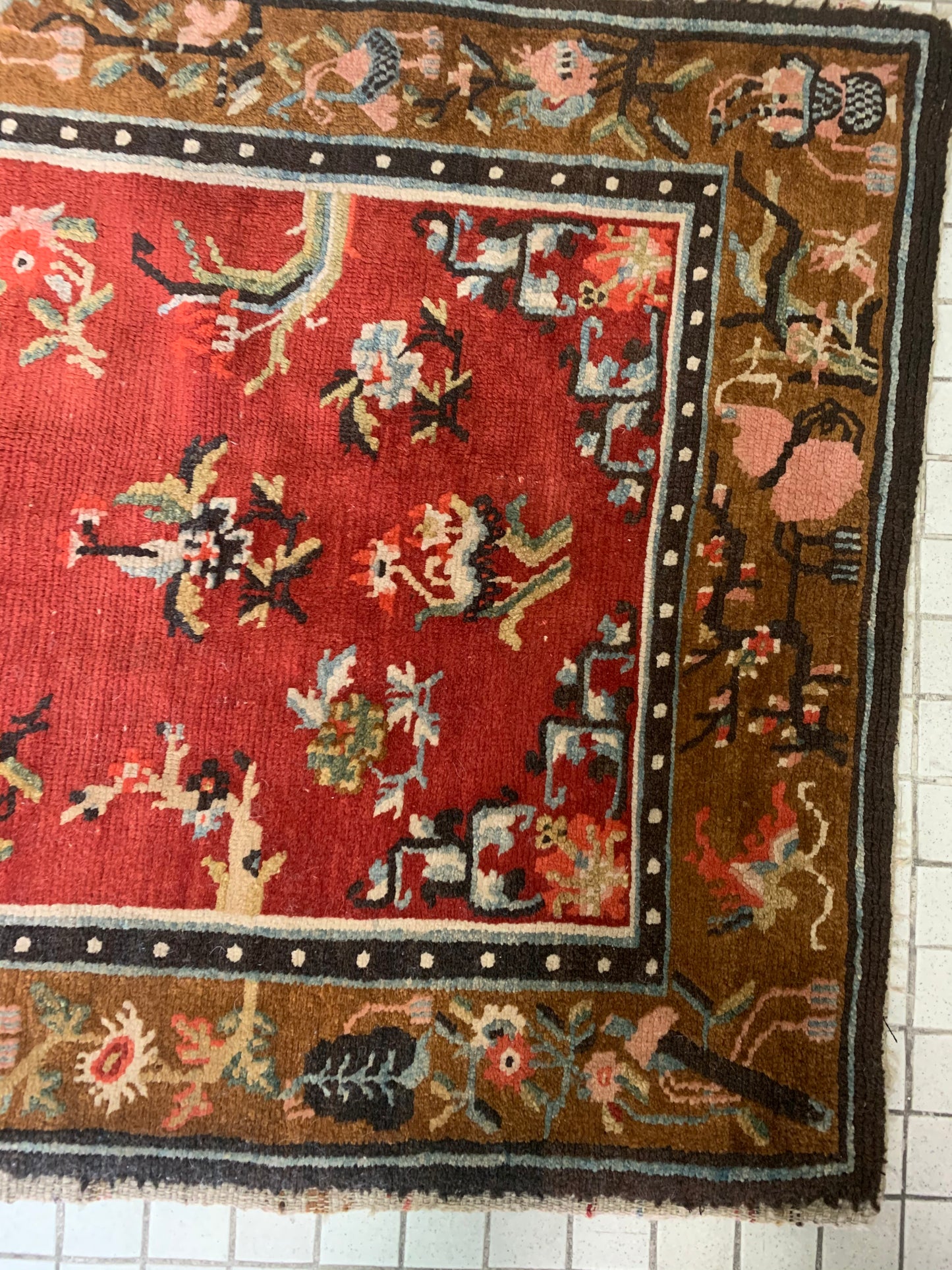 An antique Tibetan wool rug