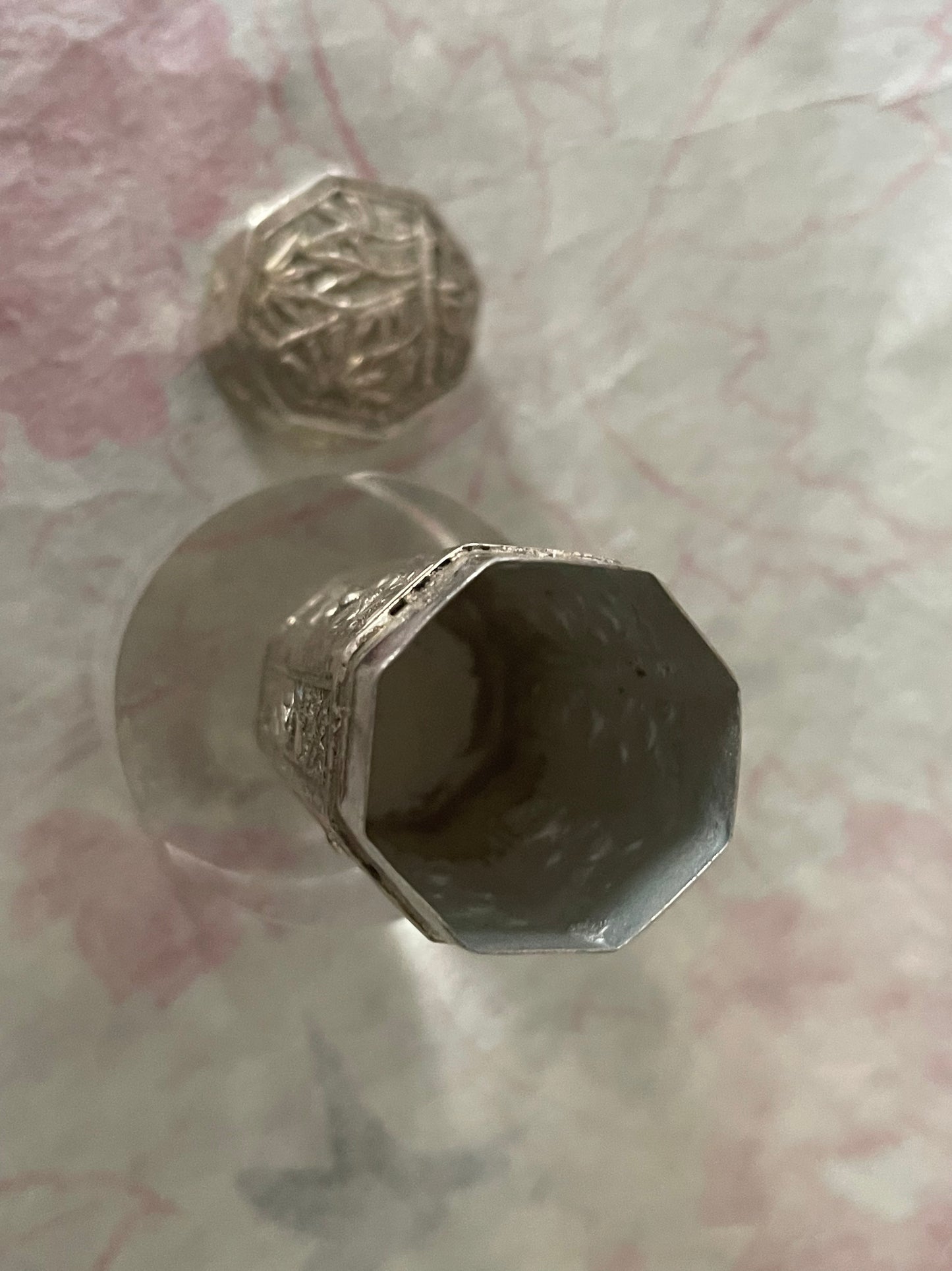 An antique octagonal shaped silver box with lid from south east Asia.