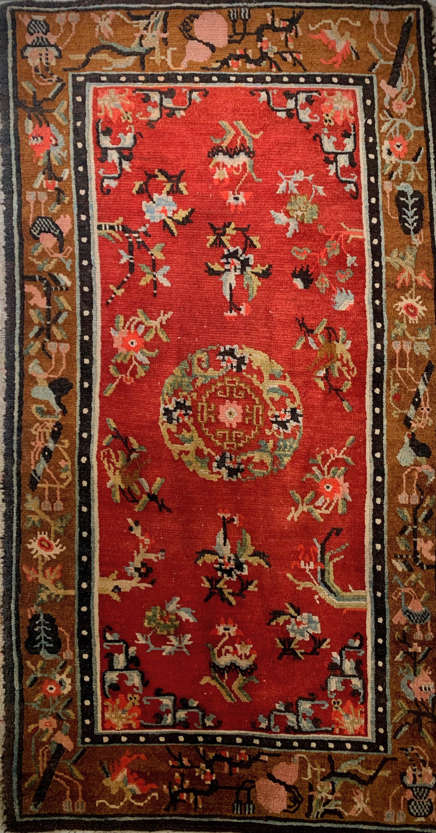 An antique Tibetan wool rug