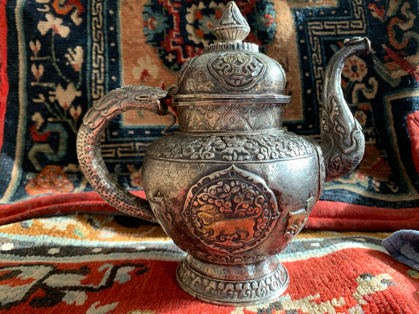 An antique silver and gilt ceremonial Tibetan teapot