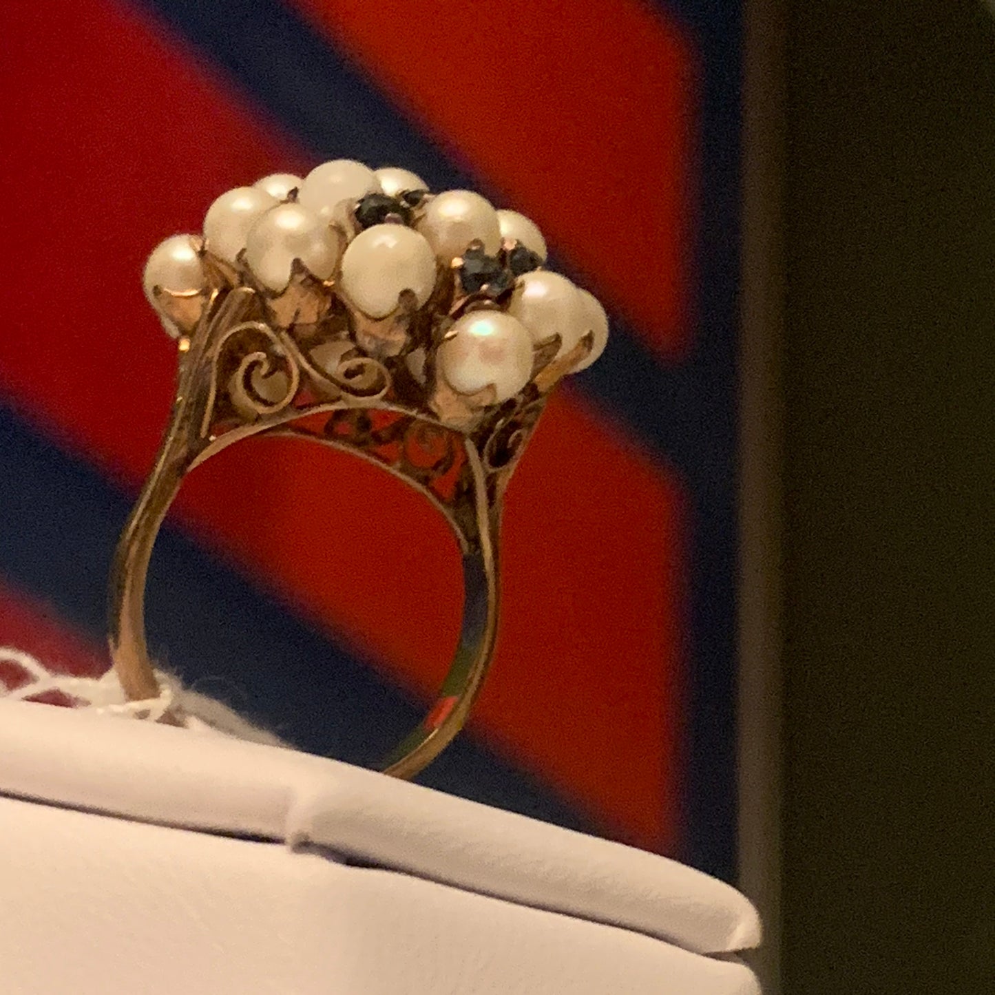 A pearl and sapphire ring in a 14kt setting
