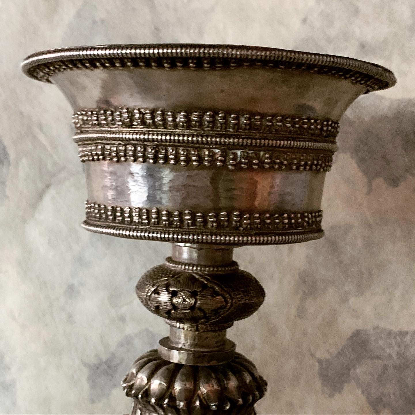 An antique Tibetan silver butterlamp