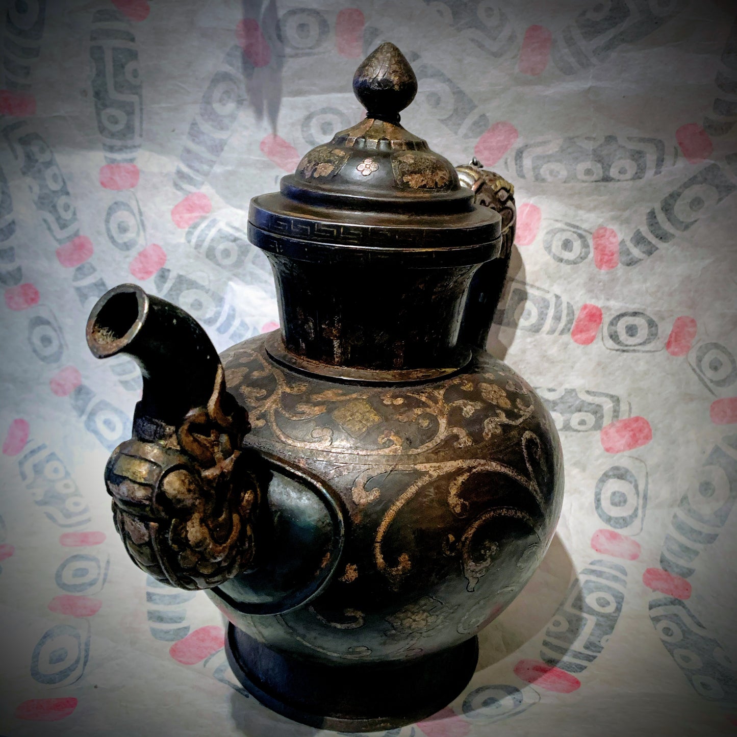 An antique Tibetan iron and silver teapot