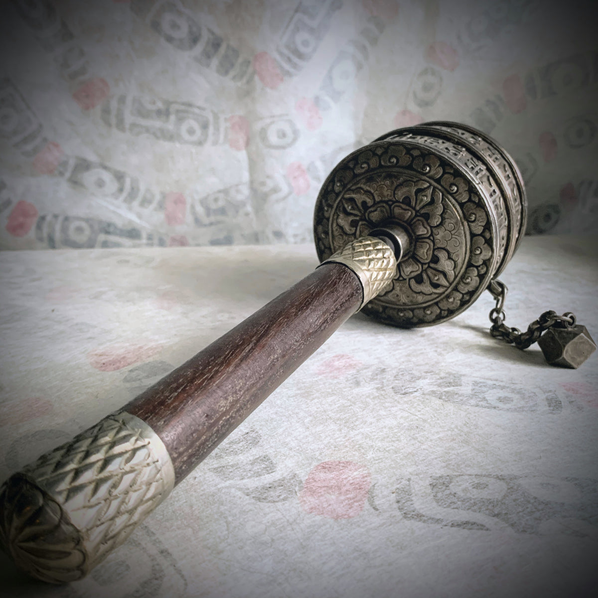 An antique Tibetan handheld prayer wheel