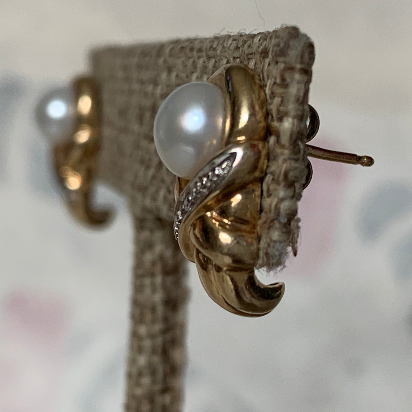 A pair of vintage pearl earrings