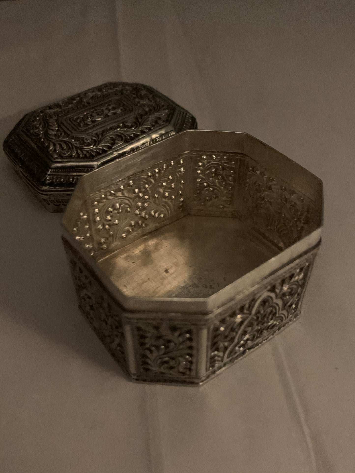 An octagonal silver box