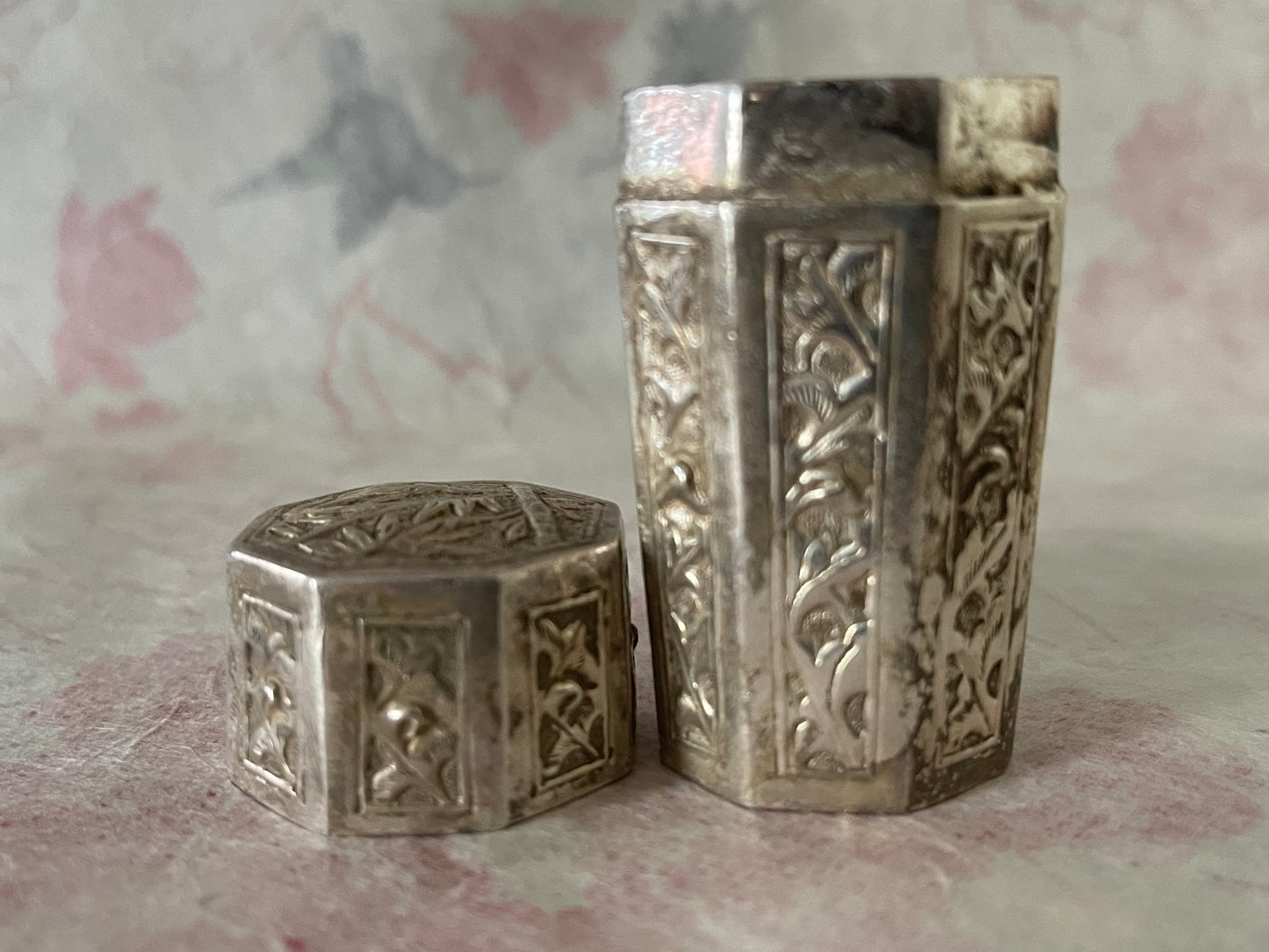 An antique octagonal shaped silver box with lid from south east Asia.