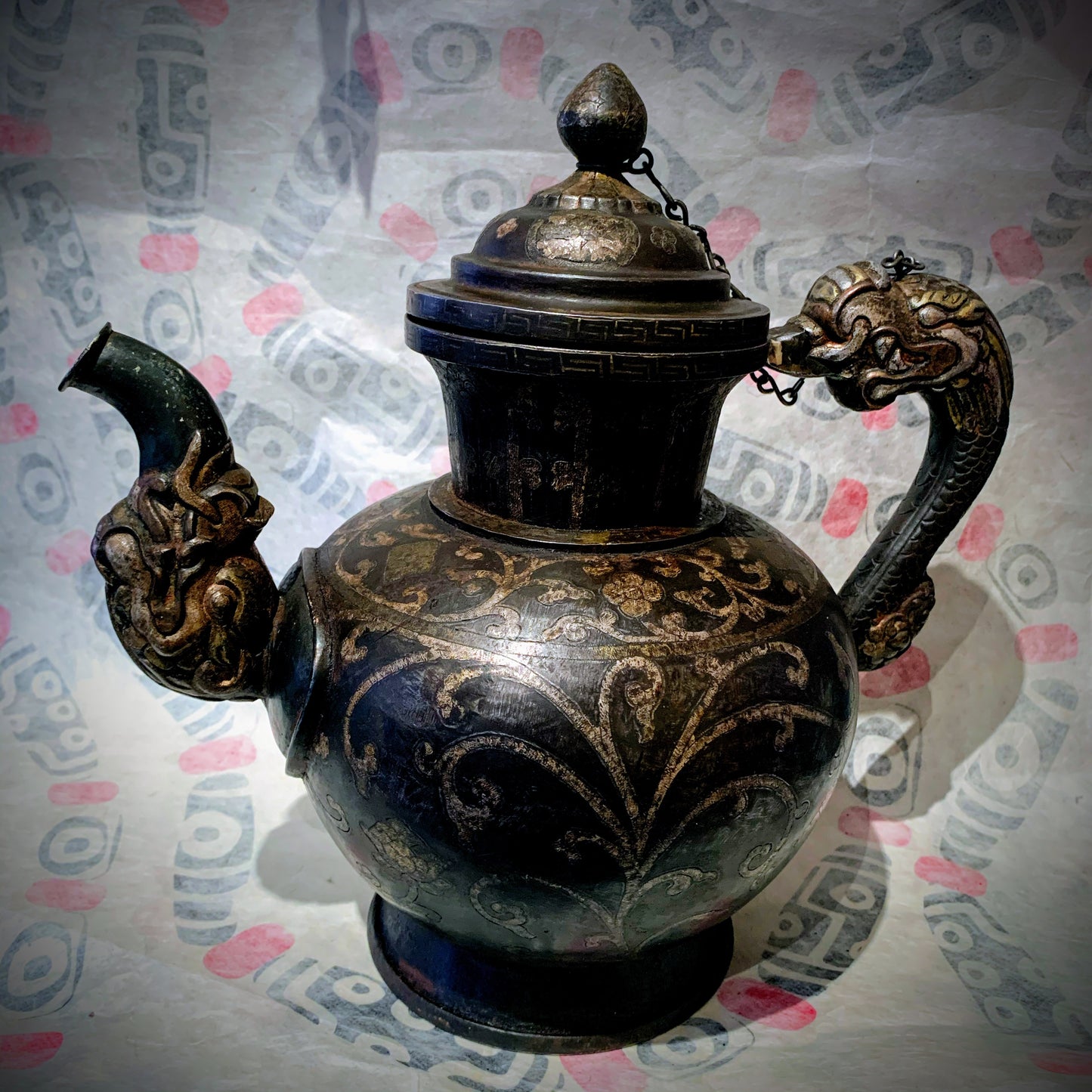 An antique Tibetan iron and silver teapot