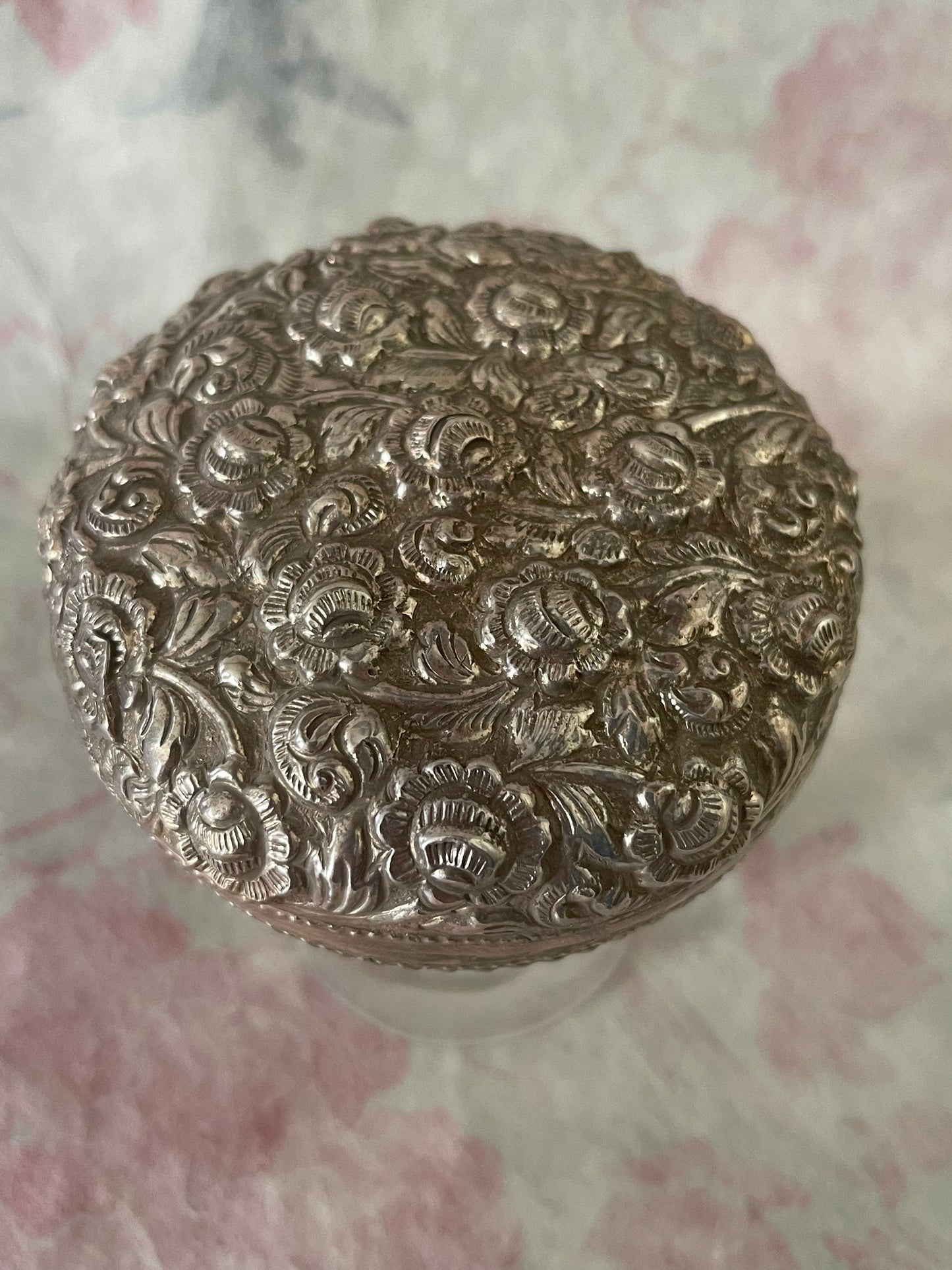 An antique silver south East Asian round box with lid