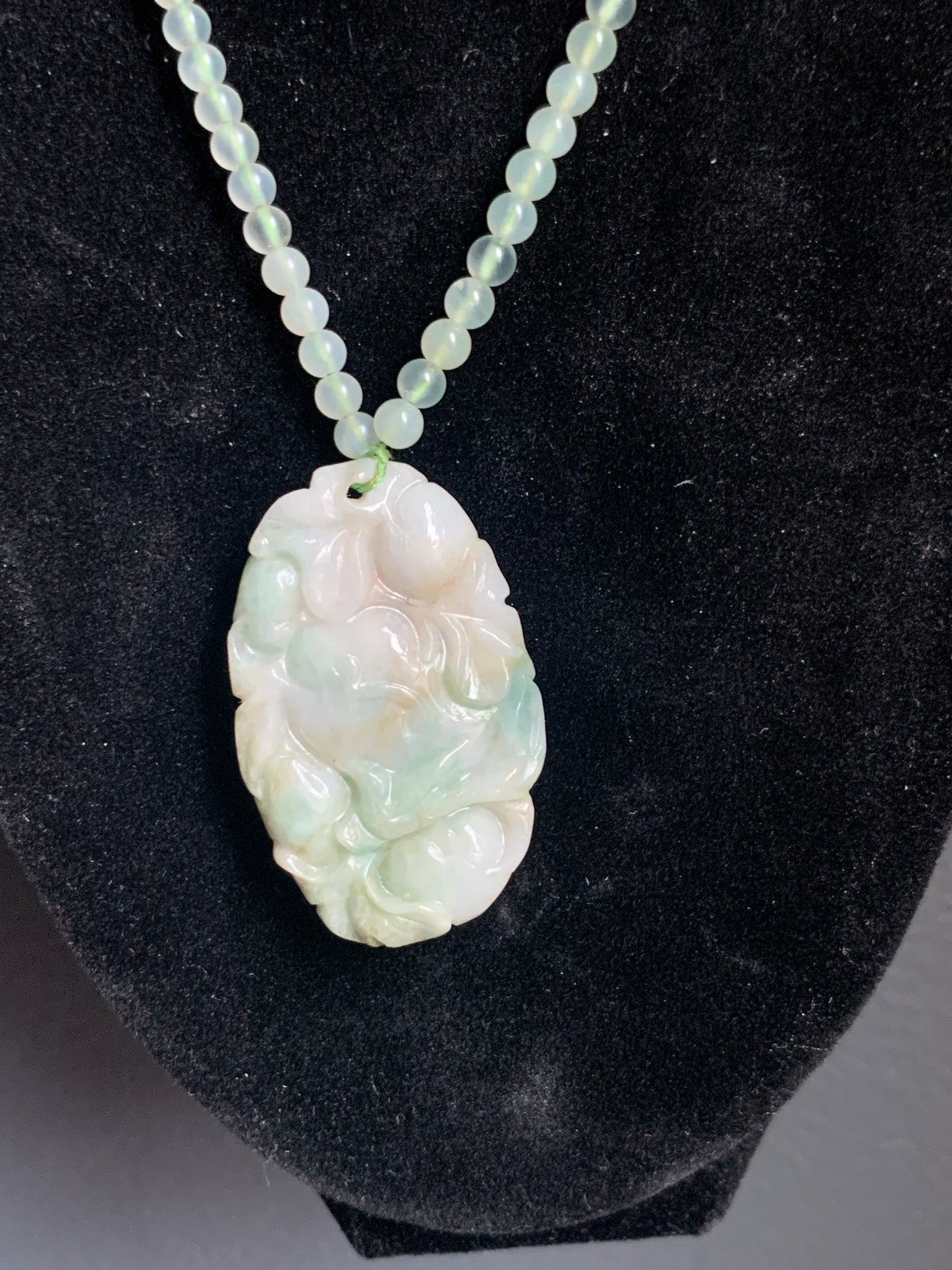 A jade necklace and pendant
